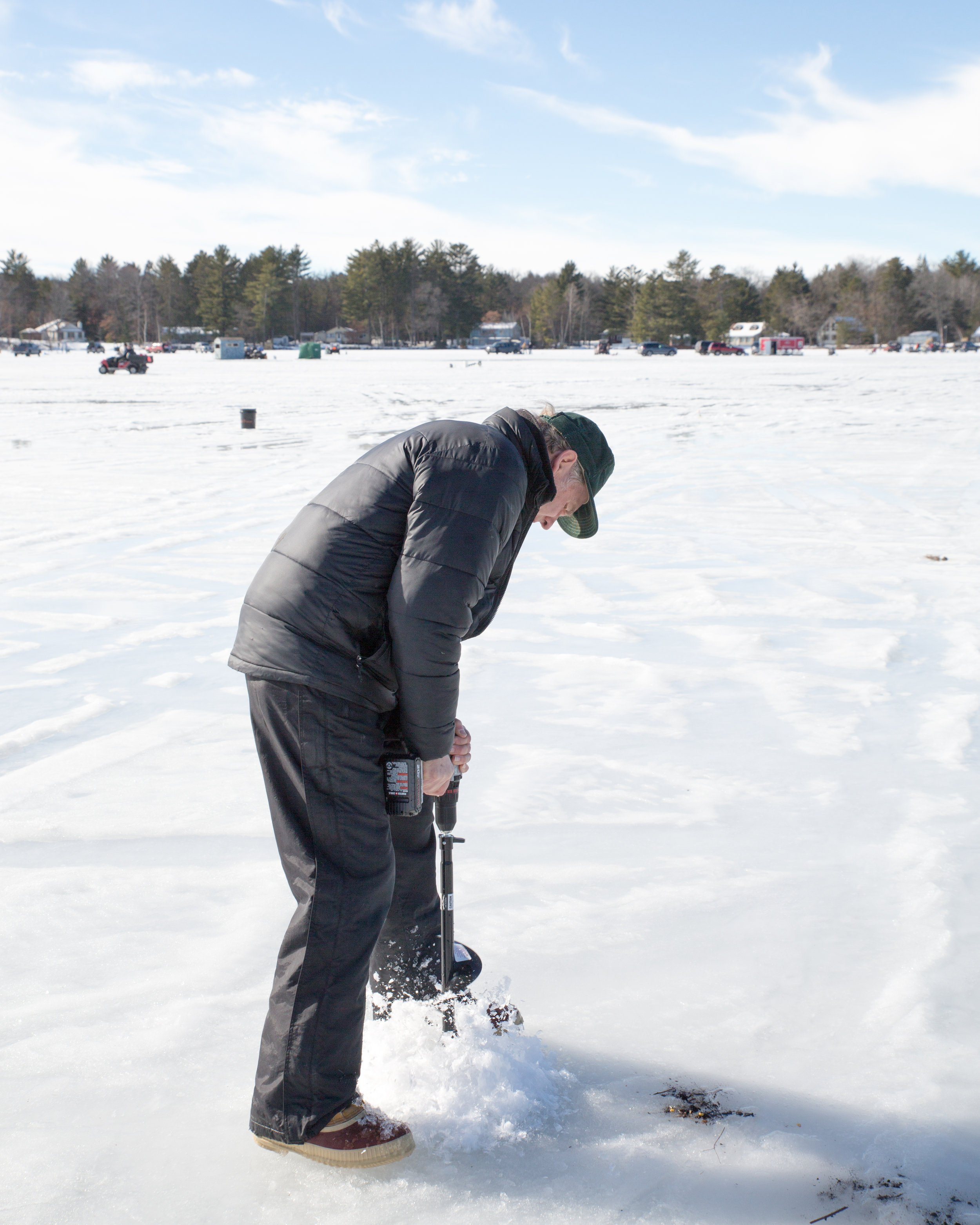 First: Grandpa drilled the hole through the ice with a cool attachment to his drill.