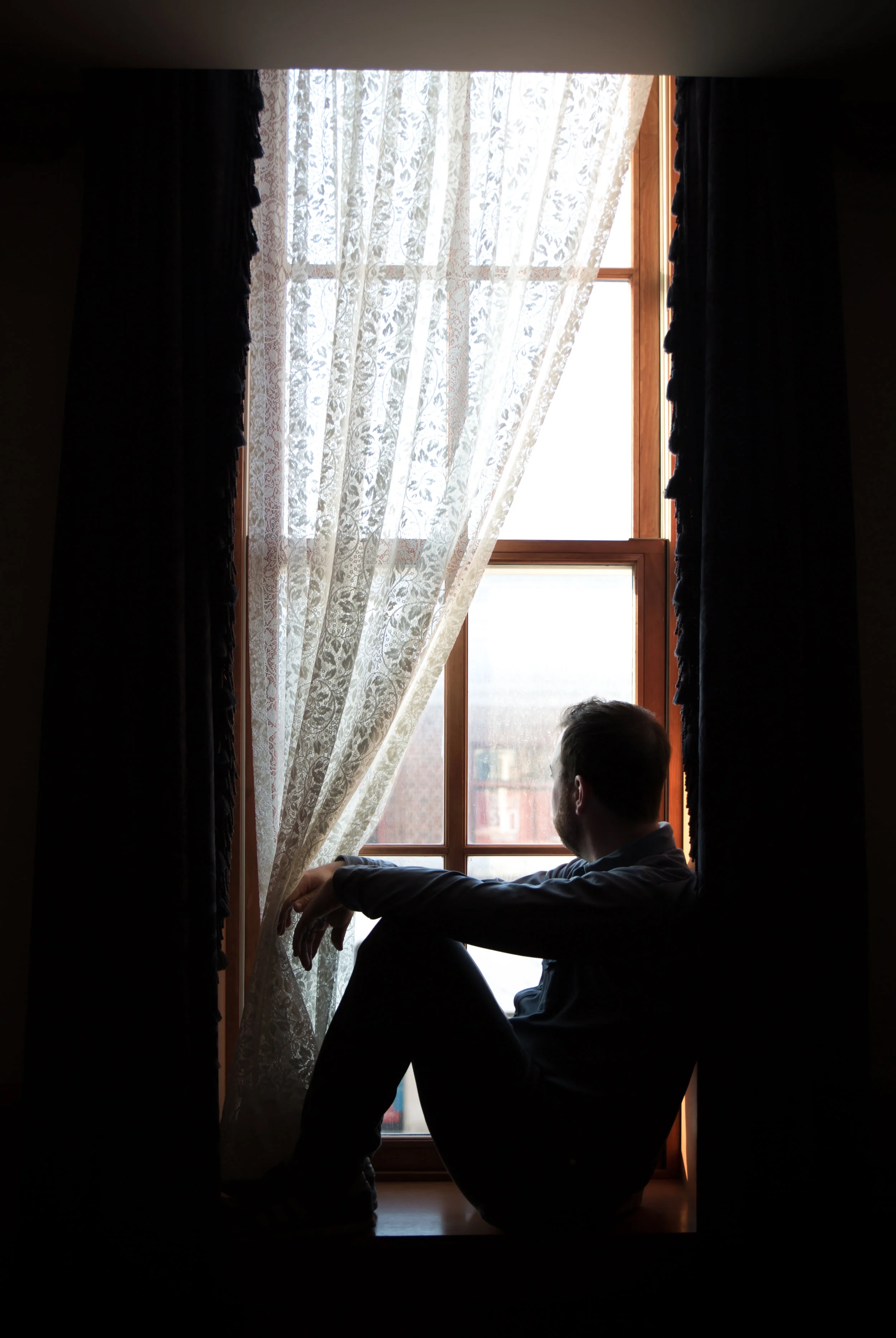 everyone in the family loved to sit in the window of our room and watch the street below