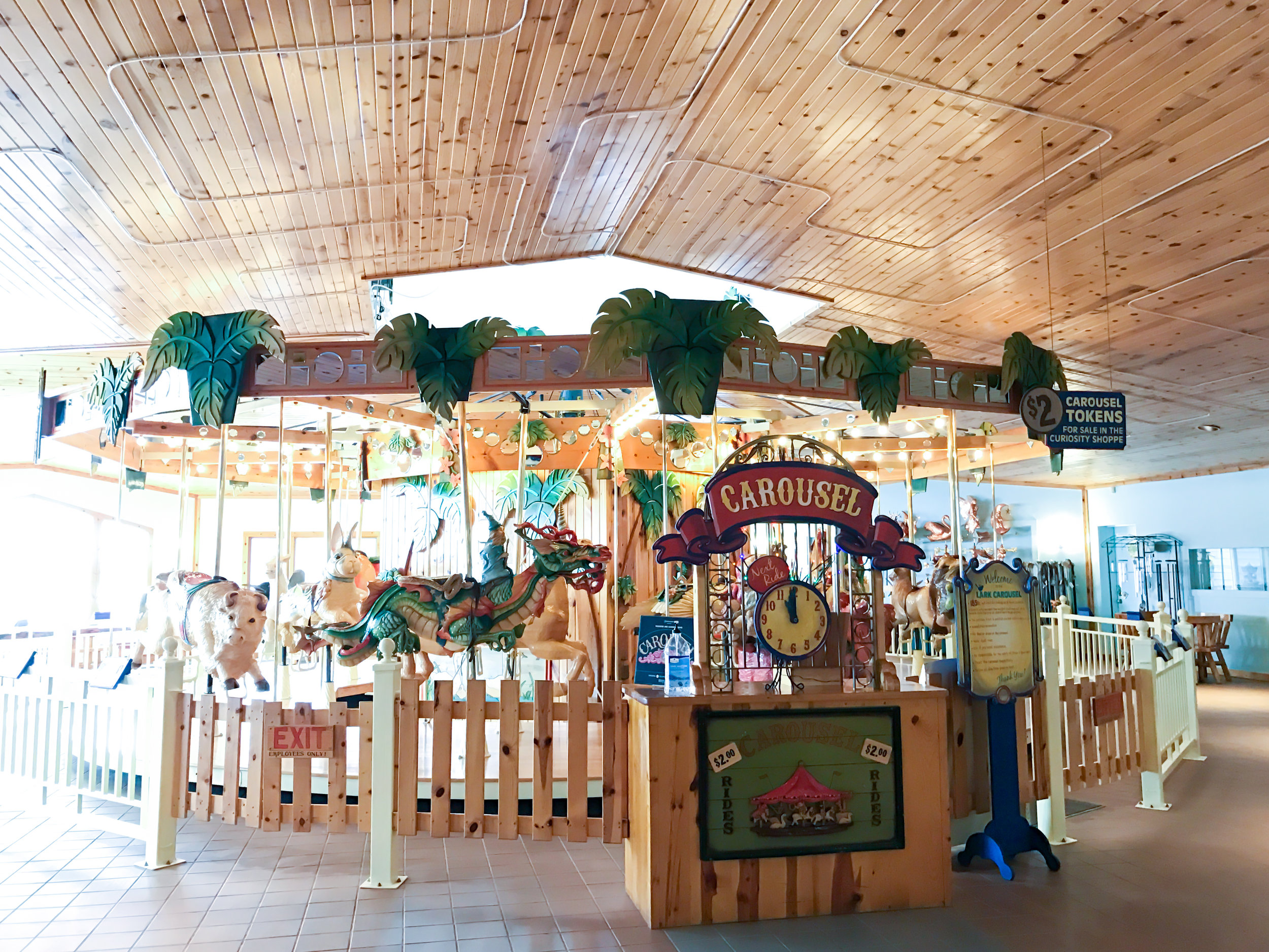 the most beautiful indoor carousel with hand carved, hand painted wooden animals at Lark Toys!