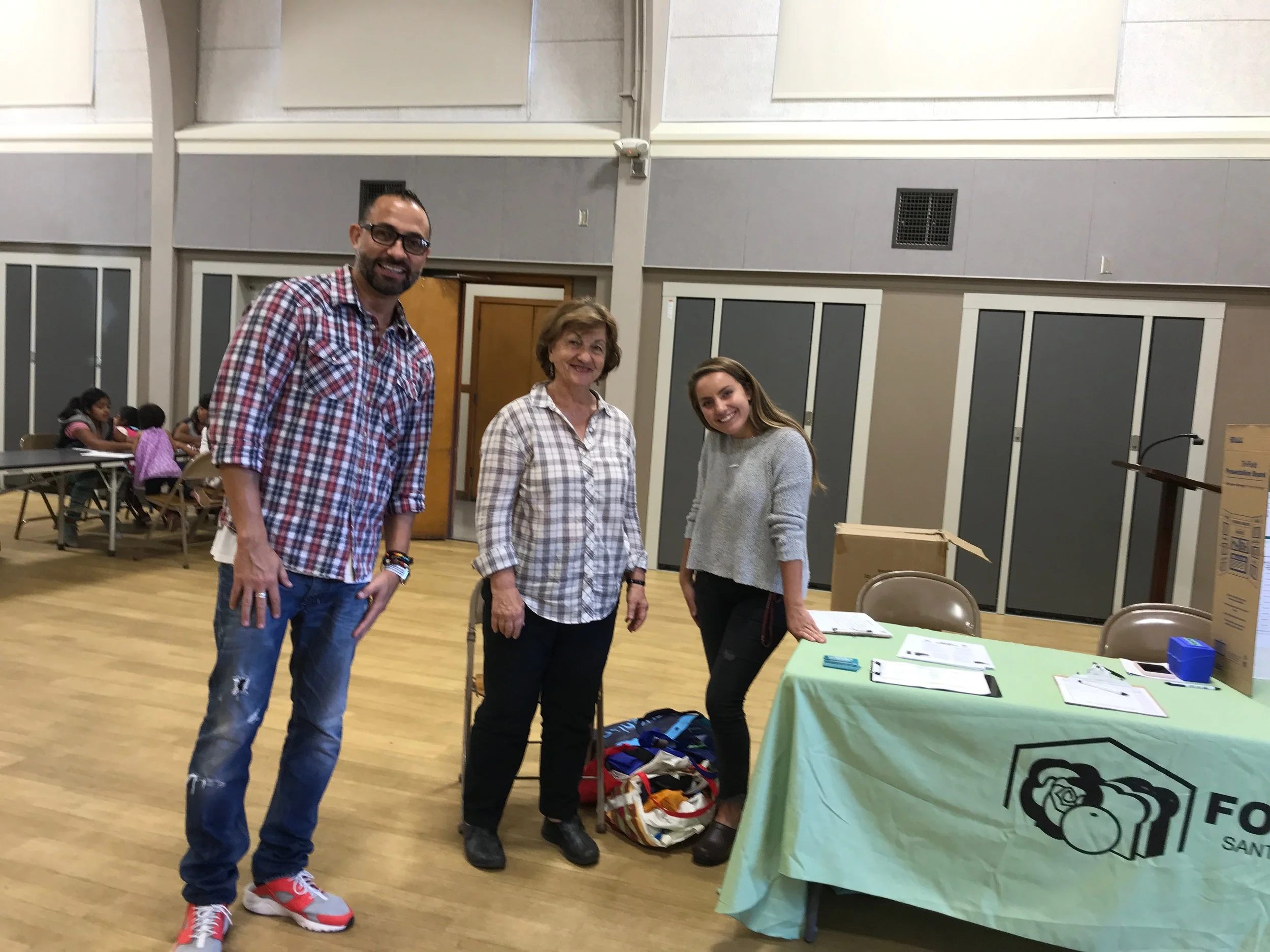 Roberto Plasencia, Trinity Episcopal Church volunteer Marlene Carroll, and Westmont intern Allie Klein at the Healthy Food Pantry