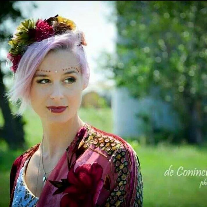 Stunning Bride Britta on her wedding day Wearing The House Of Hats custom made silk flower headpiece