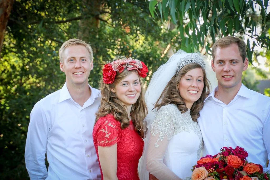 Bridesmaid Amy wearing The House Of Hats custom made headpiece