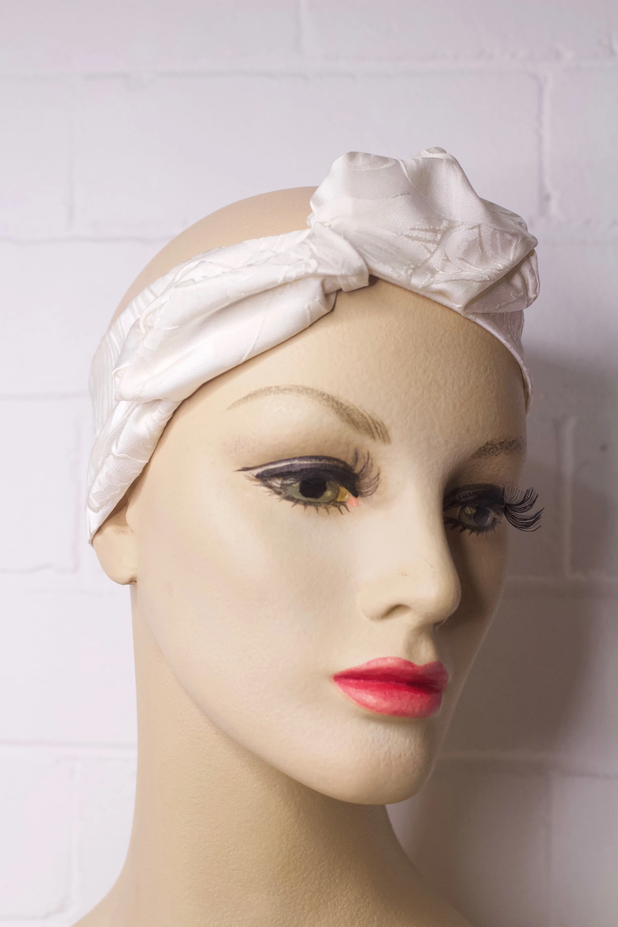 The House of Hats Cream turban Headpiece .jpeg