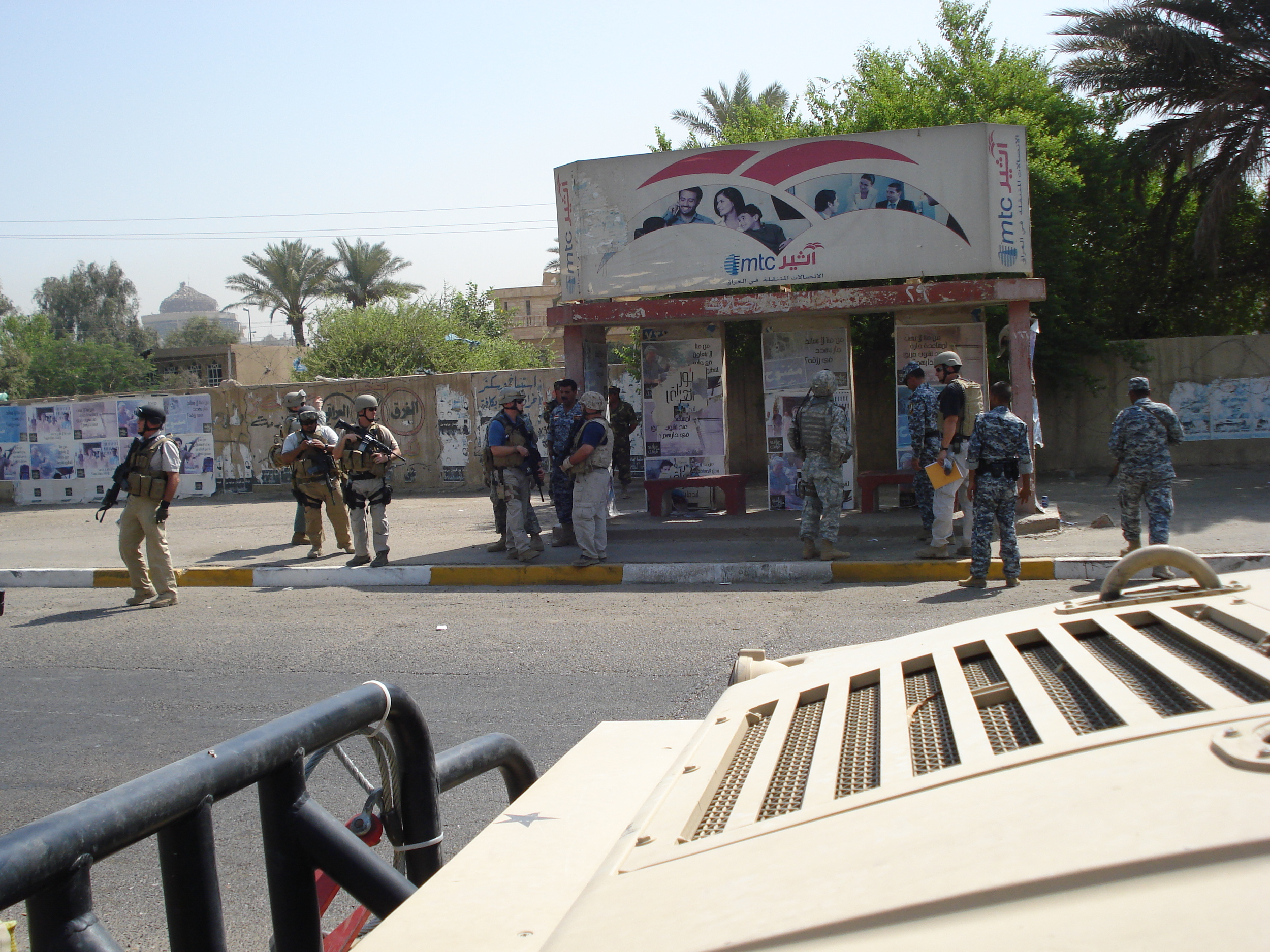 Notice how the American investigators are accompanied by the Iraqis.