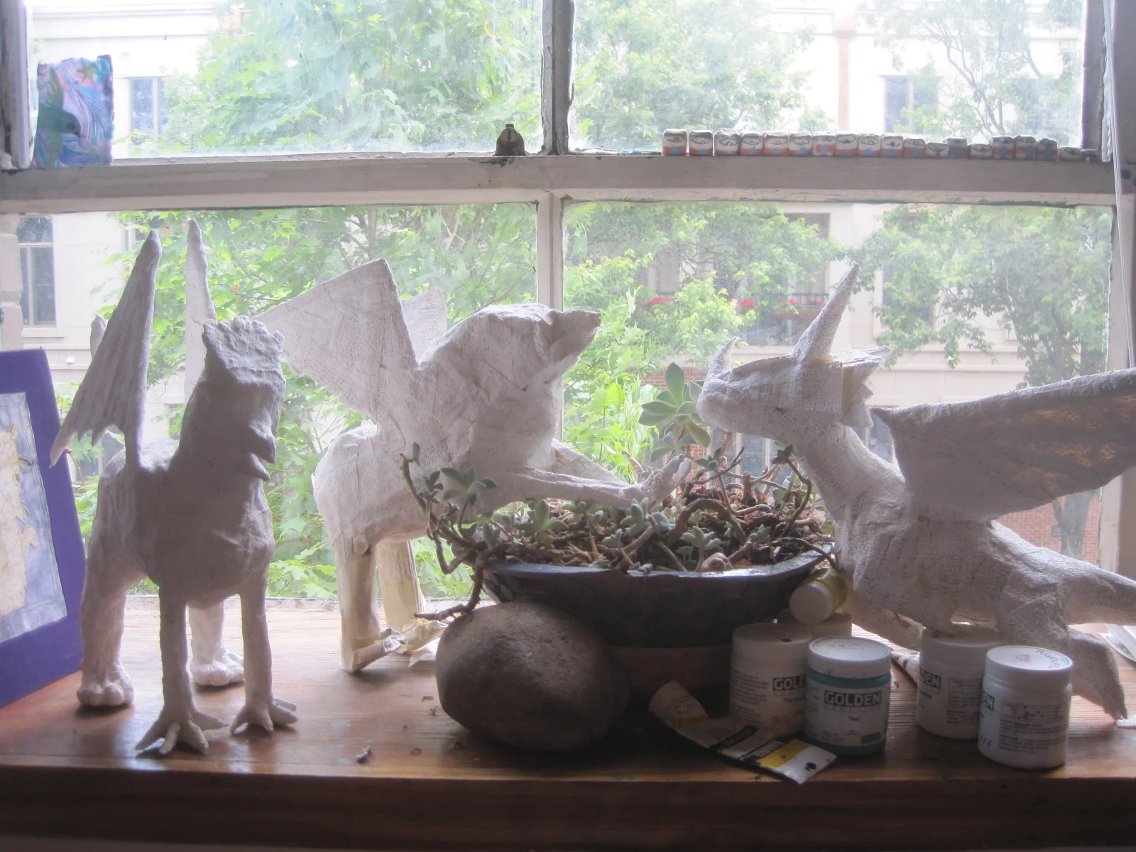 Plaster sculptures by myself and students. Two gryphons and a dragon.