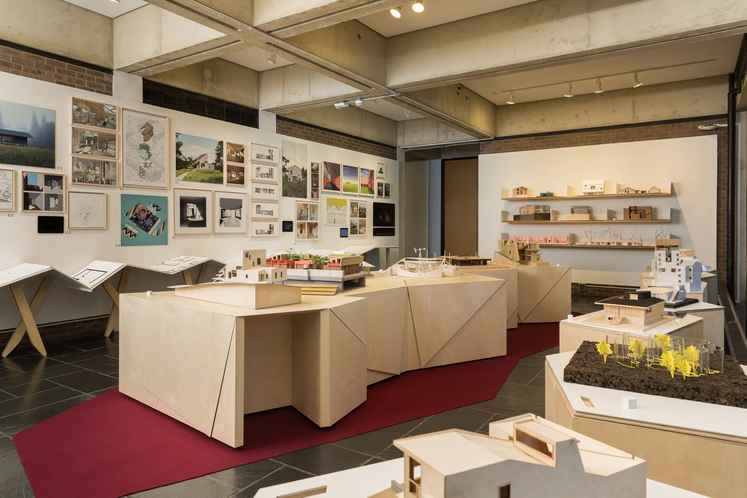 Photography by Ian Byers-Gamber. Exhibition of The House Transformed at Princeton School of Architecture. Models and furniture take over the image.