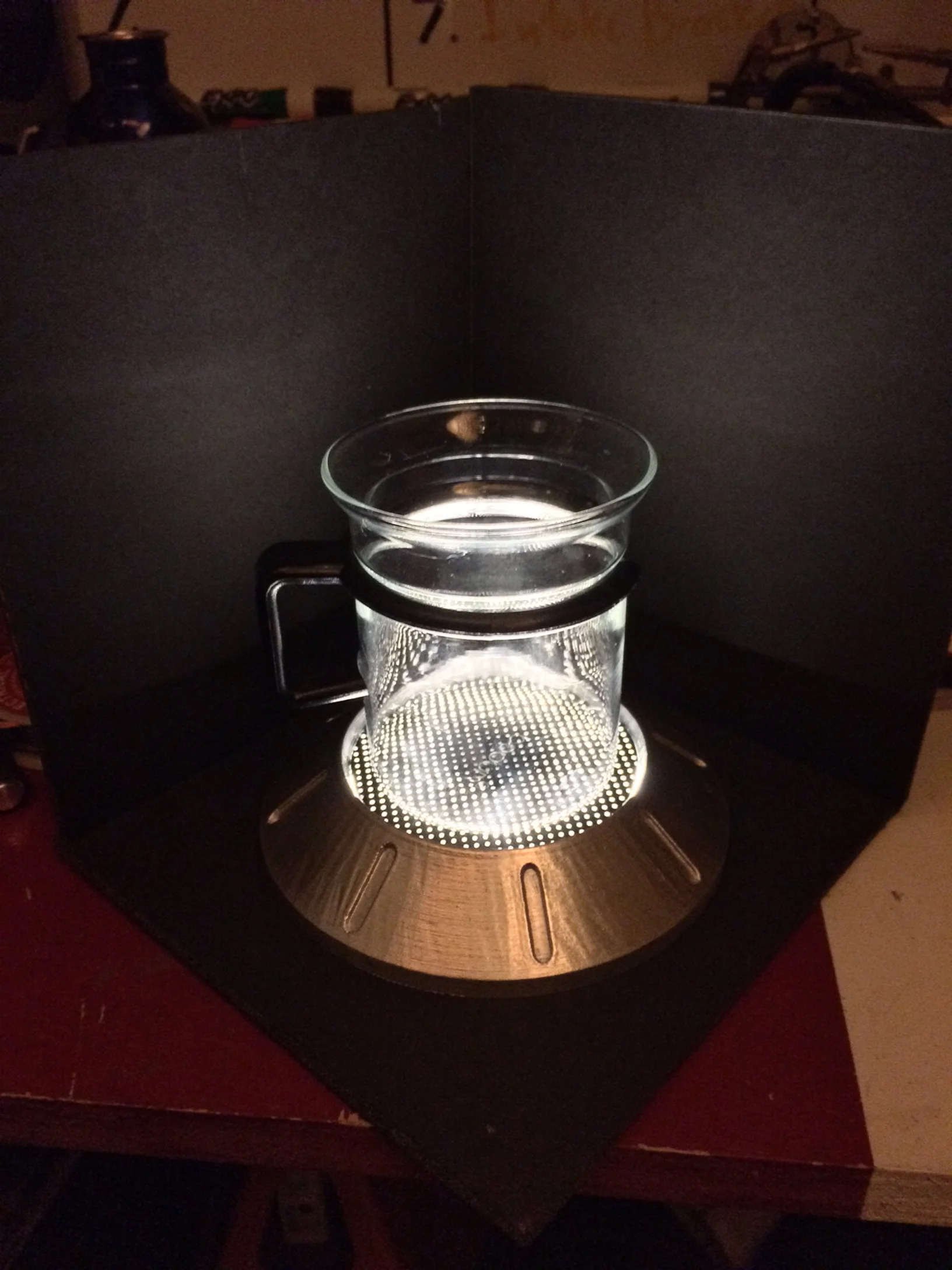  Notice the points of light warping around the cup 