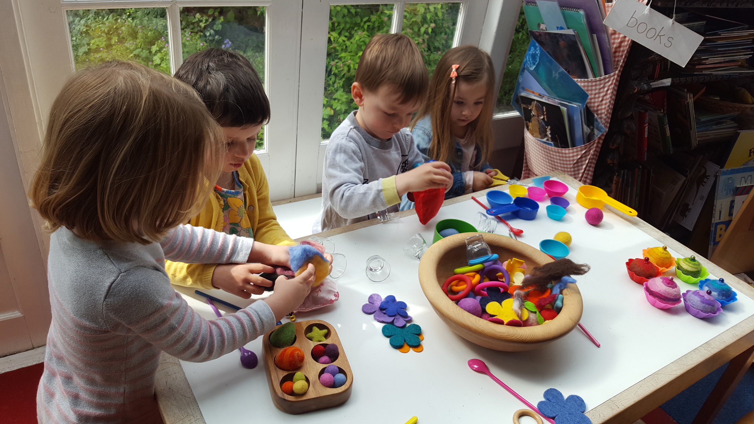  Children sort, count and match with lovely sensory wool balls and felted cakes 