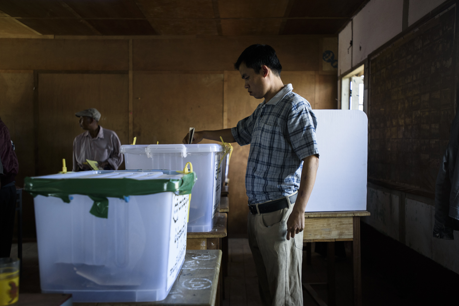 A man casts a ballot at a polling station in One Leng's district in Lashio, Myanmar.