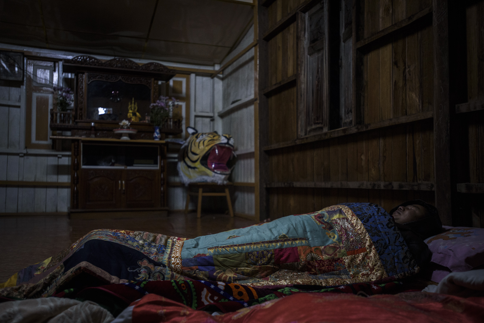 One Leng sleeps on the second floor of the SNLD headquarters in Lashio. Although he does not have all the results, he said he thinks he can win before bedding down for the night.