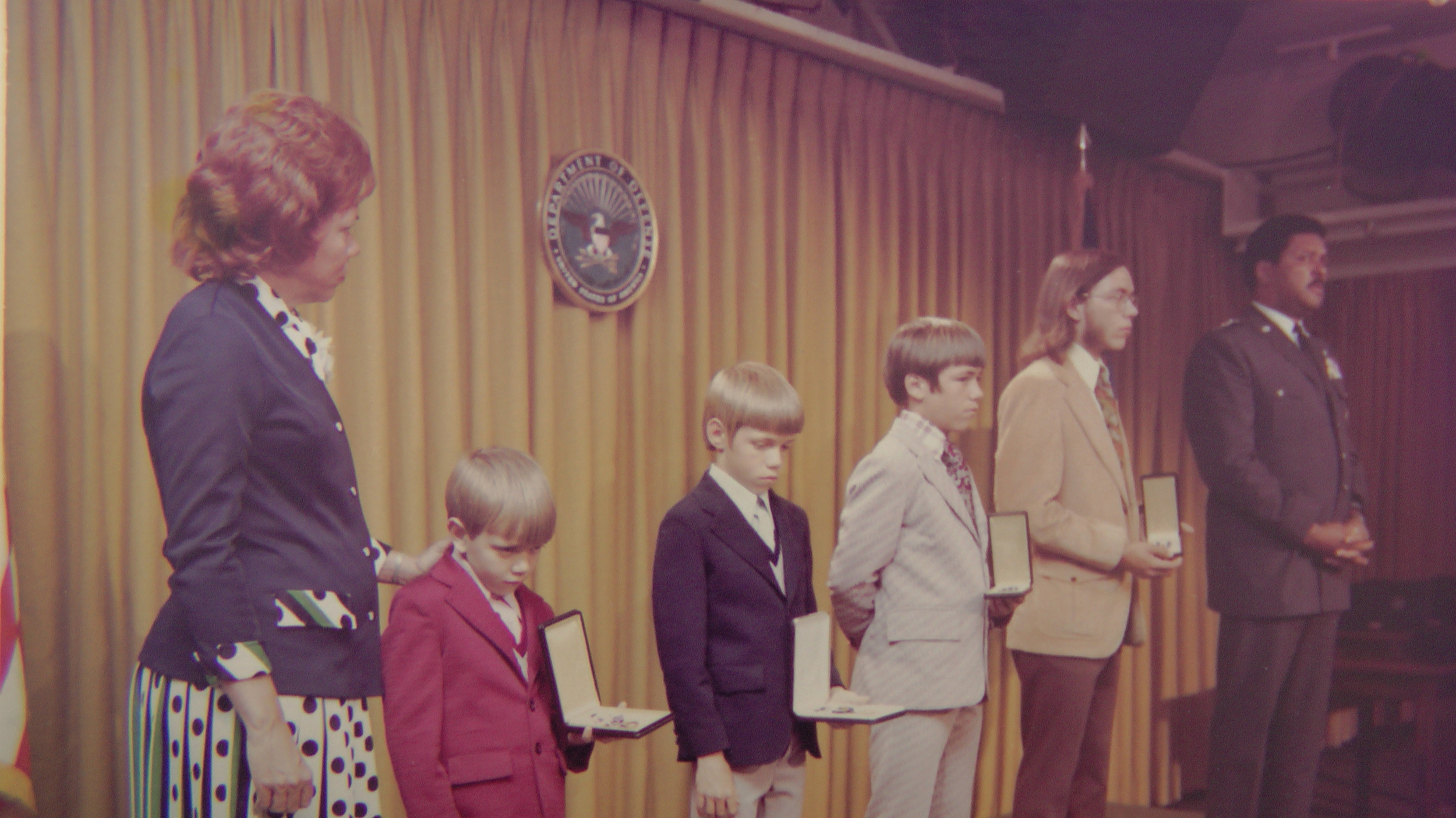  The Grubb sons receive medals in honor of their father from General Daniel "Chappie" James, Jr. 