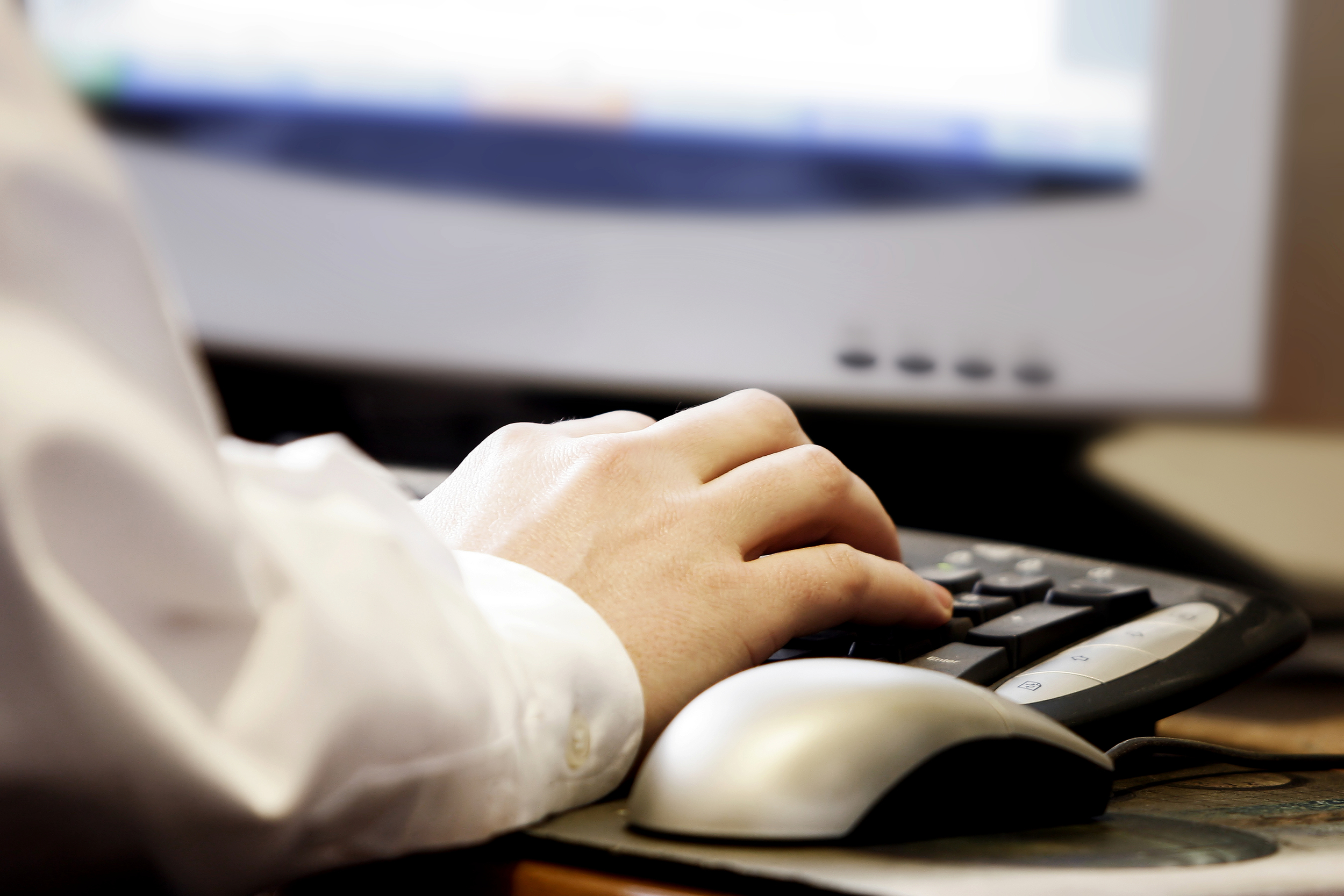 Contact_Us_Banner_Hand_Typing_Computer.jpg