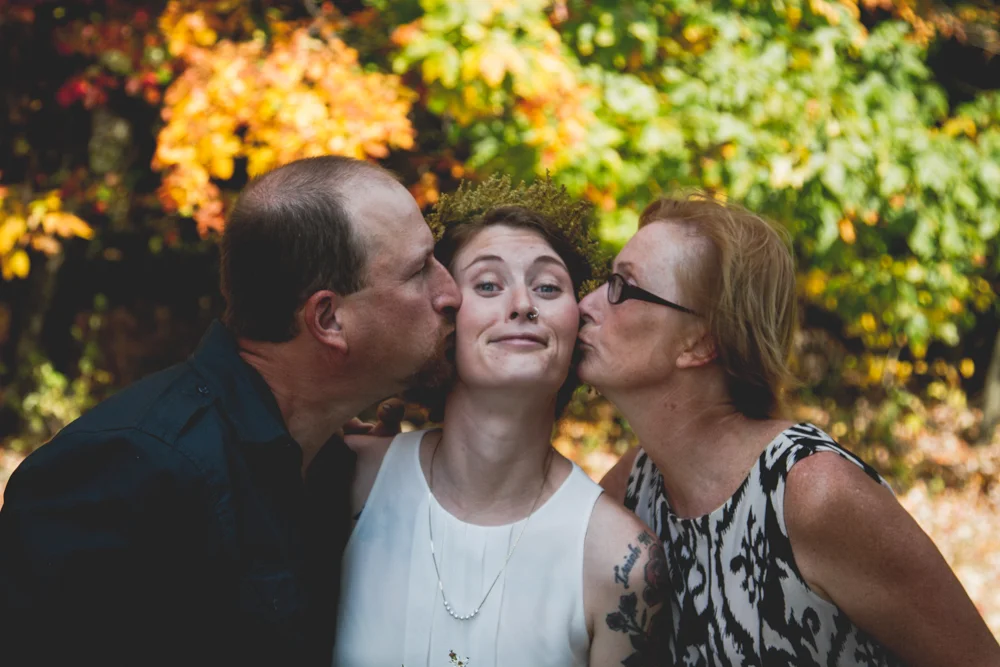 Kisses from my parents at our wedding.