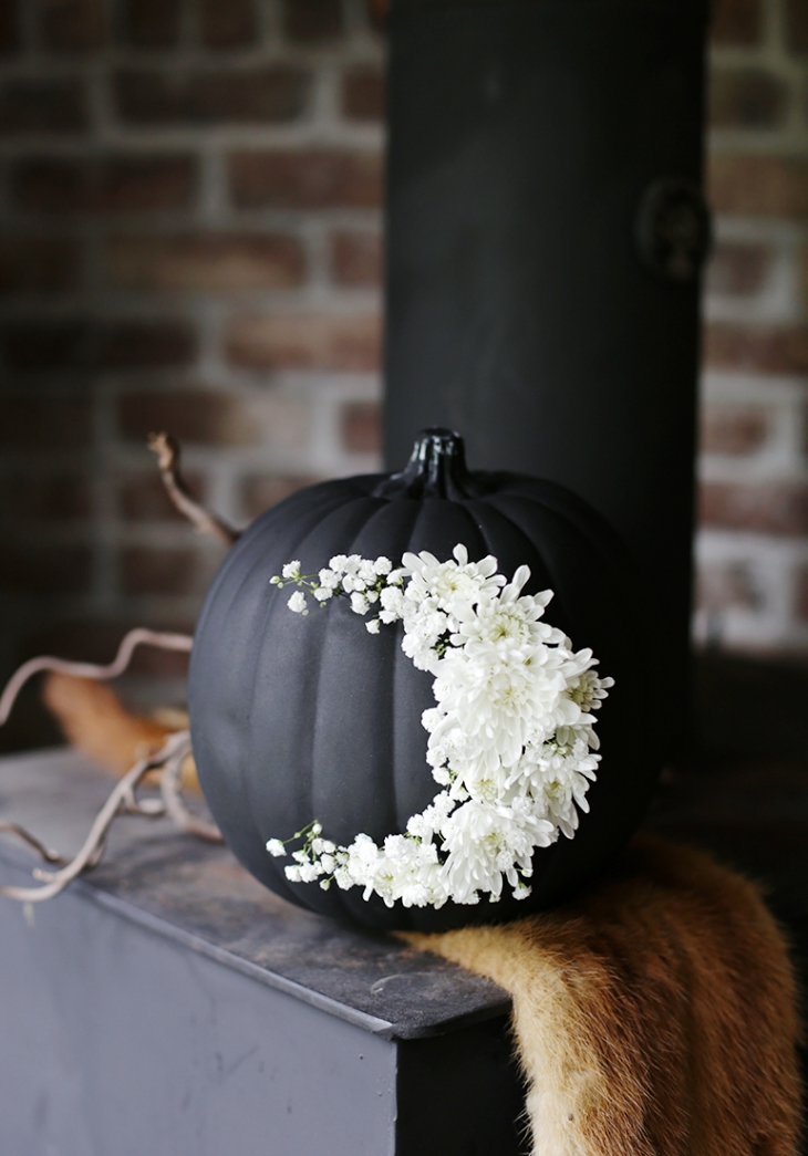  A black pumpkin is spooky but a floral crescent moon softens the look. Photo:  The Merry Thought  