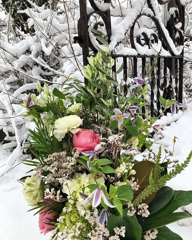 Charmelia alstroemerias, clematis, roses, and a lot of greenery for a fresh out the garden look.
