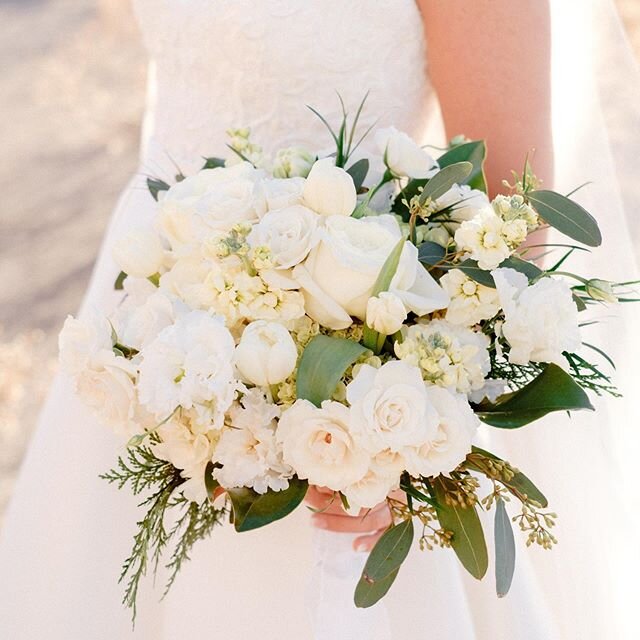 Tulips, stock, spray roses, frilled lisianthus, mondial roses all in white for Amanda&rsquo;s bouquet. 📸 @bailey.pianalto