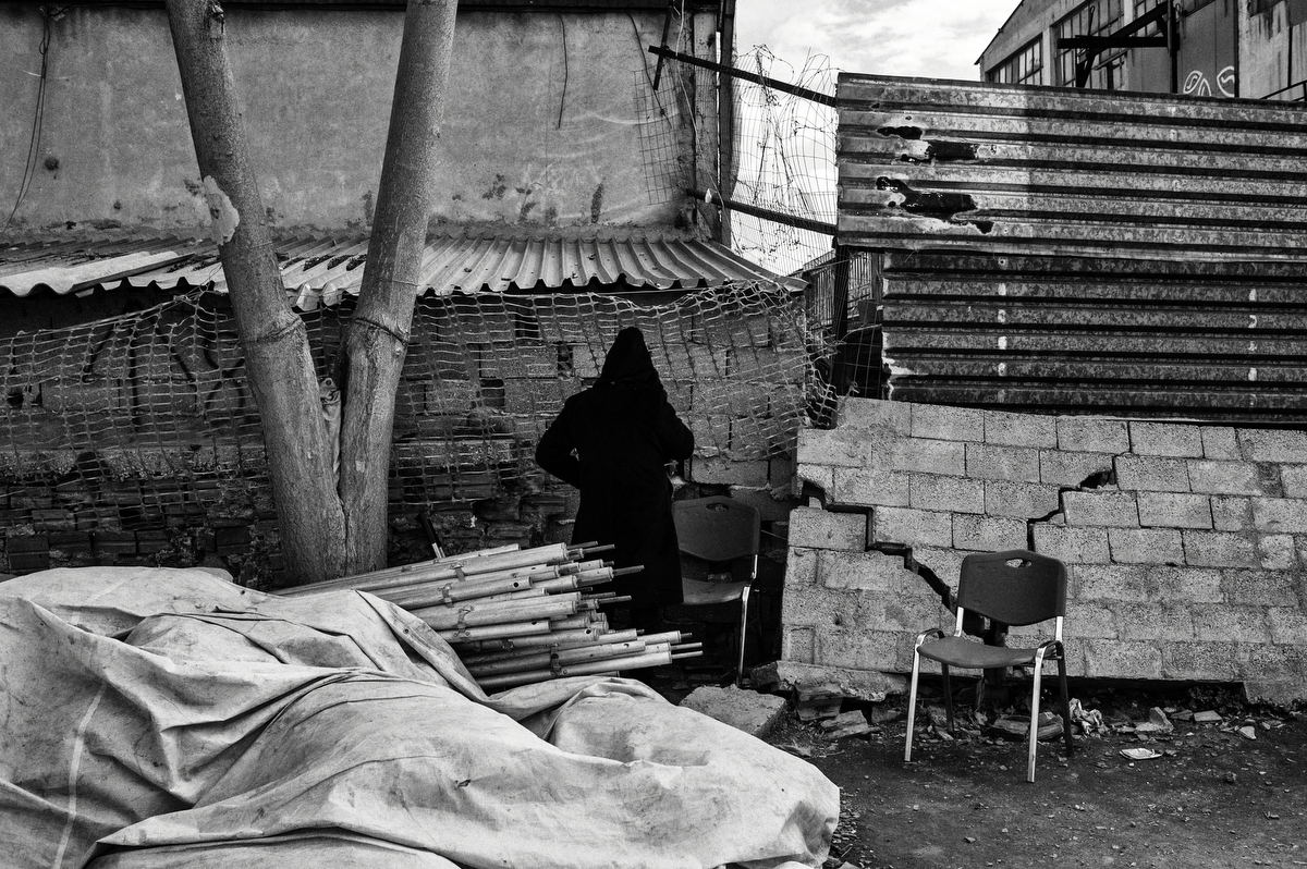  A refugee is trying to find the WiFi range service in Eleonas, a government owned refugee camp. This temporary camp, settled on the outskirts of the city, offers bunkhouses, health and legal care and a meal a day for all refugees. Athens, Greece, Ja