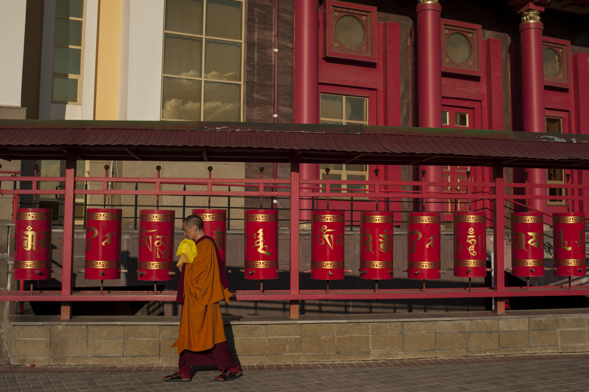  A buddhist monk at the Golden Adobe of Buddha Shakyamuni Temple, build in 2005 it remains the biggest buddhist temple in Europe. Elista, Russia, May 2016. 