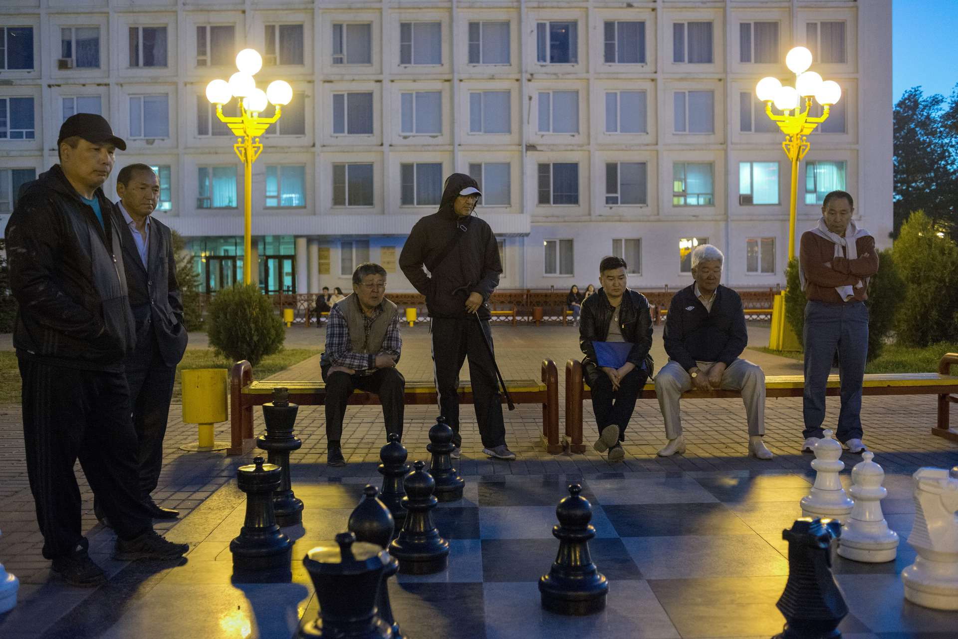  Men playing chess in the central square of Lenin. Chess became the national sport in Kalmykia after the former republic's president, Kirsan Ilyumzhinov, actual president of the FIDE, and who ruled the republic for 17 years, encouraged chess at all s