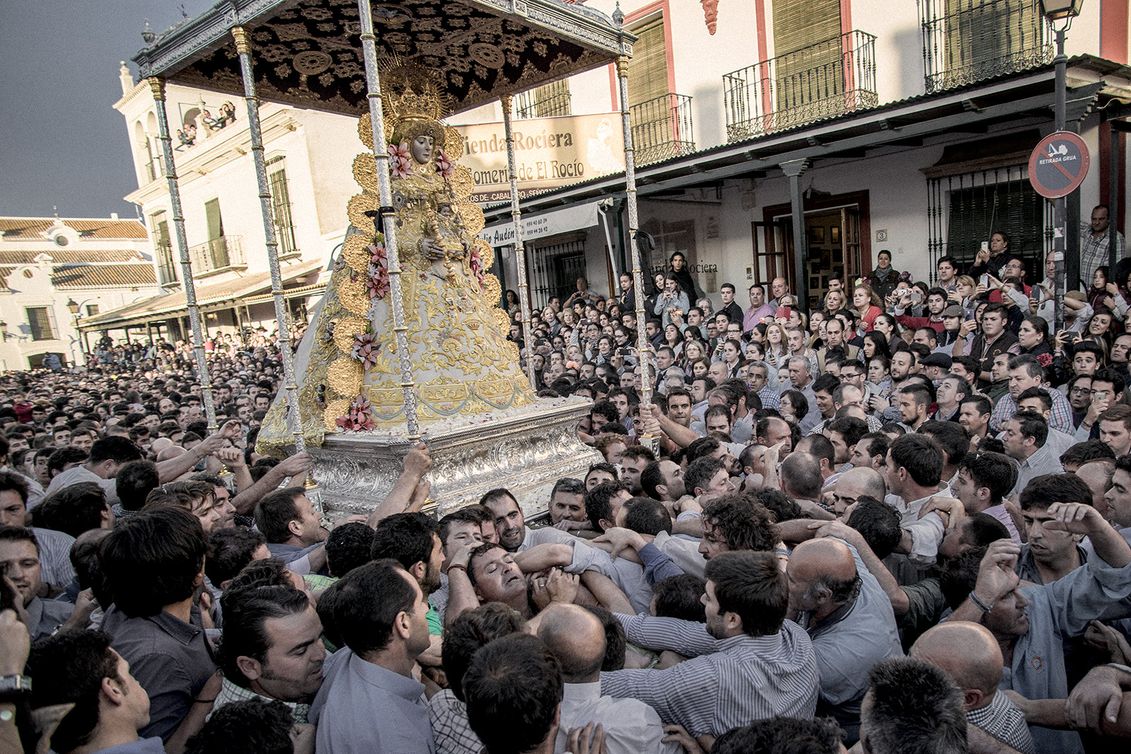 The next day after Pentecost's Sunday the brotherhood of Almonte exhibits the original Virgin Mary of El Rocío. An almost 12 hour non-stop parade in which people fights to touch or carry the statue. El Rocío, Spain, May 2015.
