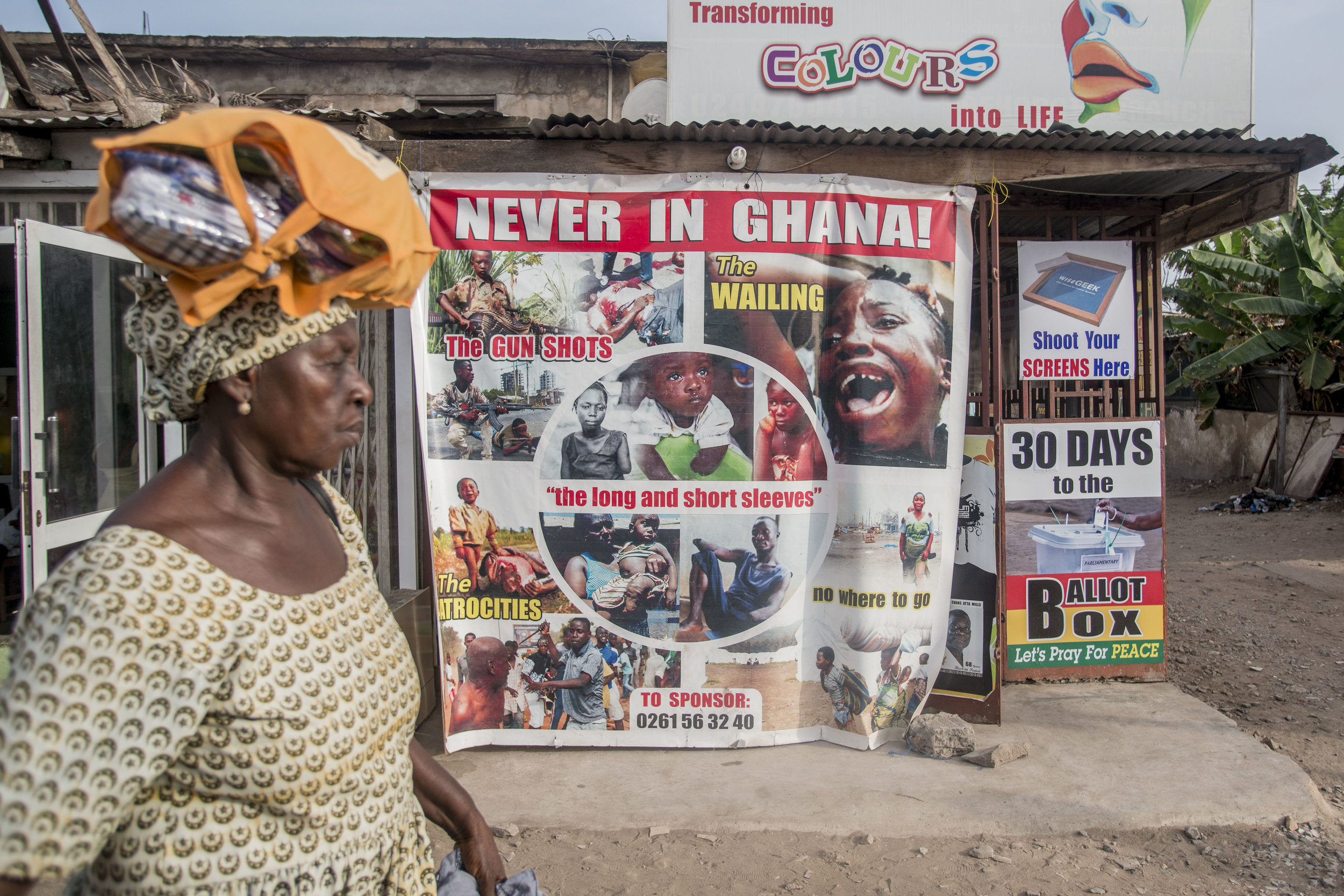  A woman pass by a billboard promoting the No Violence in Ghana. Being one of the oldest democracies in West Africa, Ghana prepares for the incoming general election on the 7th December. In various spots around the city of Accra countdowns for the el