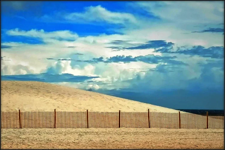 fence-clouds.webp