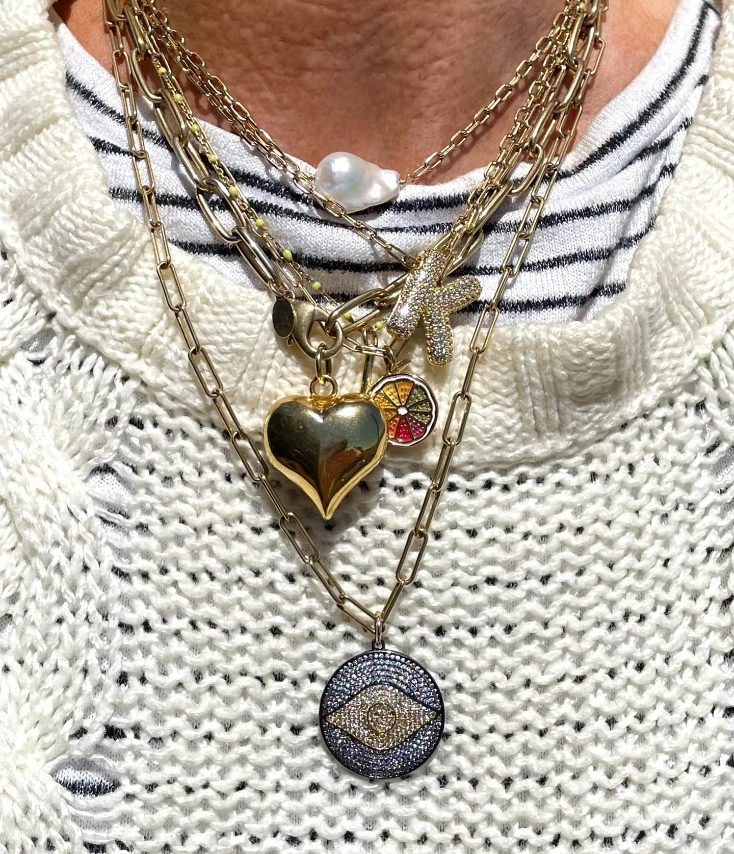 Walking billboard @kara_dellovo - Tis true you really can create a strong layered neck look and have that be your outfit&rsquo;s &ldquo;statement piece.&rdquo; Jeans &amp; a T and stack em up I tell ya! #layerednecklaces #charmnecklace #initialneckla