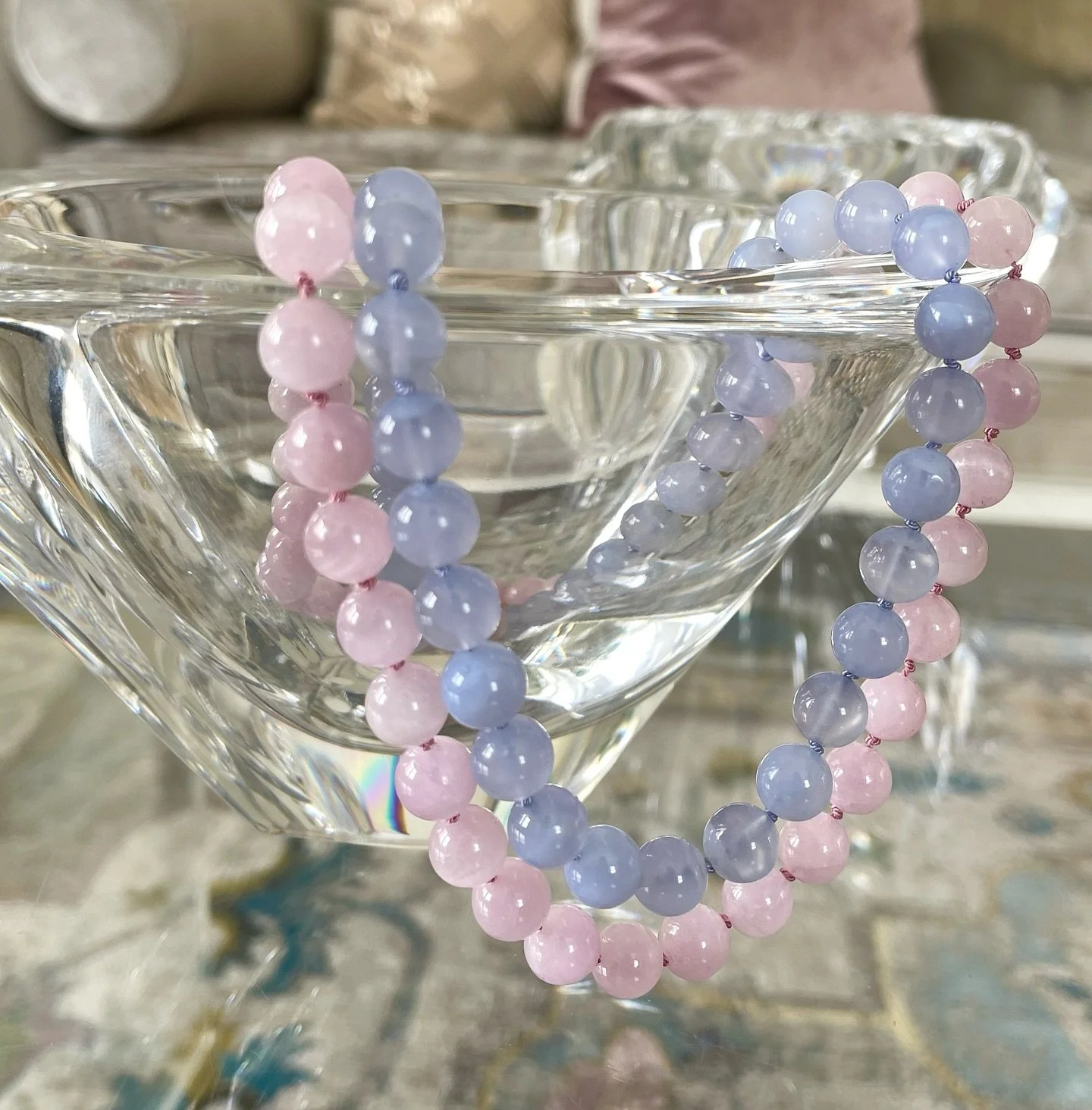 Forever a fan of pink &amp; purple - especially these Luminous Chalcedony and Kunzite rounds. They&rsquo;ll not only spruce up your neck stack, how about zzhuzz your tablescape? I can dig it #gemstonejewelry #handknottednecklace #chalcedony #kunzite 