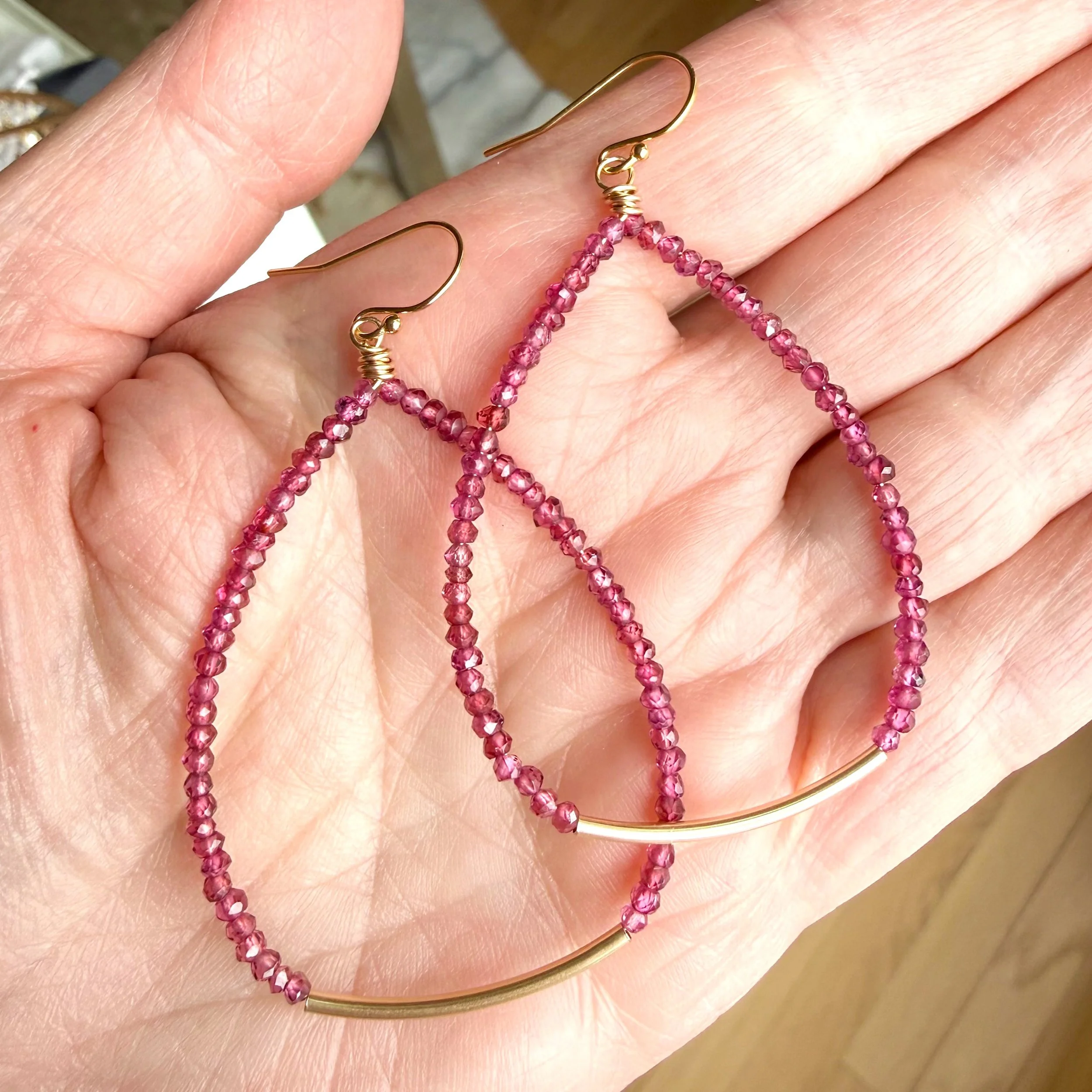 While garnet is often overlooked, these little beauties command attention with the most luscious, deep cabernet hue. Hand-strung with gold accents, the mix of micro-faceted and organic nugget-like gems catch the light beautifully. Sparkly and chic, t