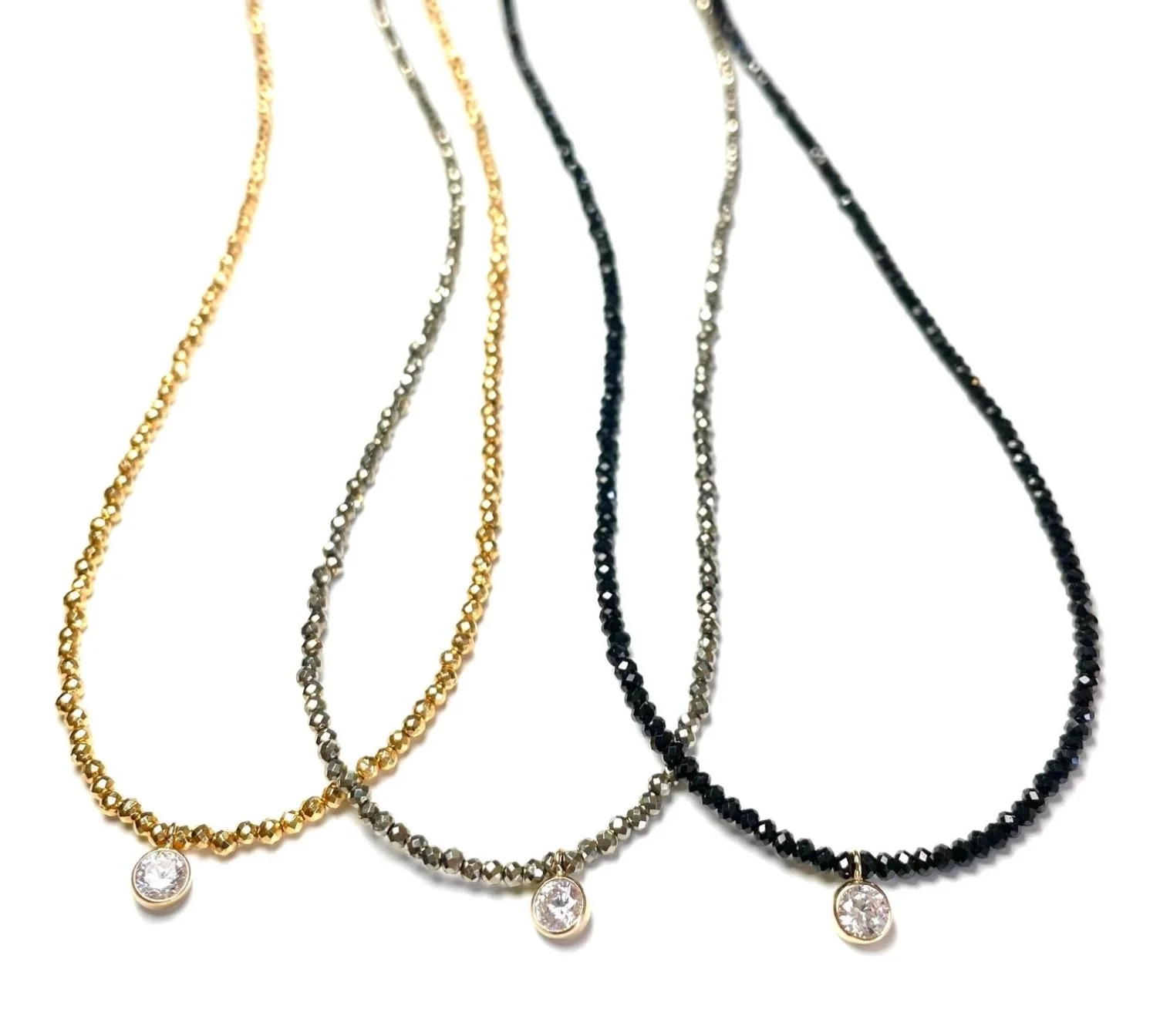 Everyone is having a love affair with these micro beaded necklaces with an itty-bitty CZ pop. In a myriad of gemstones. #beadedjewelry #handmadejewelry #layeringnecklaces #jennifertutonjewelry