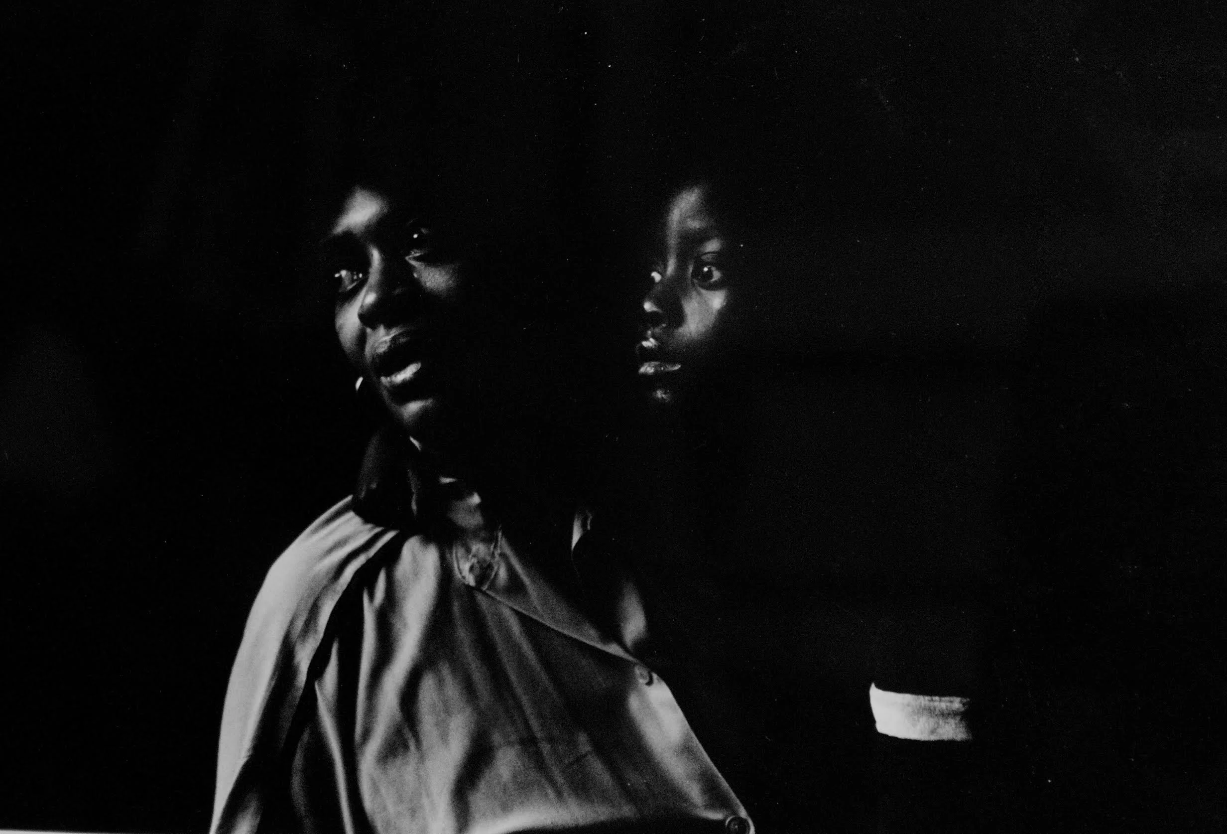 1994. Grandmother and caregiver to her grandchild, who was born with HIV. Both the child's mother and father died from AIDS, as did the child a few months after this photo was taken. Photograph by Bill Bayer. 
