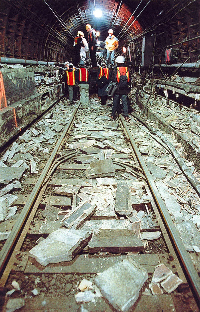 Engineers from Port Authority of NY and NJ walk the entire length of train tracks inside the PATH tunnel from Exchange Place in Jersey City to the World Trade Center station in New York City, which were flooded with water from the 9/11 attacks on May 2, 2002. The tunnel was reopened on June 29, 2003. Photograph by Bill Bayer / The Jersey Journal .