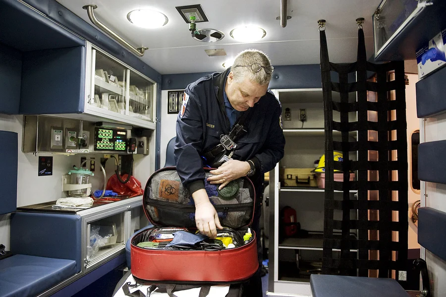 From the February 7, 2012, Jersey Journal: "Bill Bayer checks his jump bag, a basic medical kit EMTs carry on every call, at the start of his shift. He began working as an EMT in 2002." Photograph by Reena Rose Sibayan / The Jersey Journal .