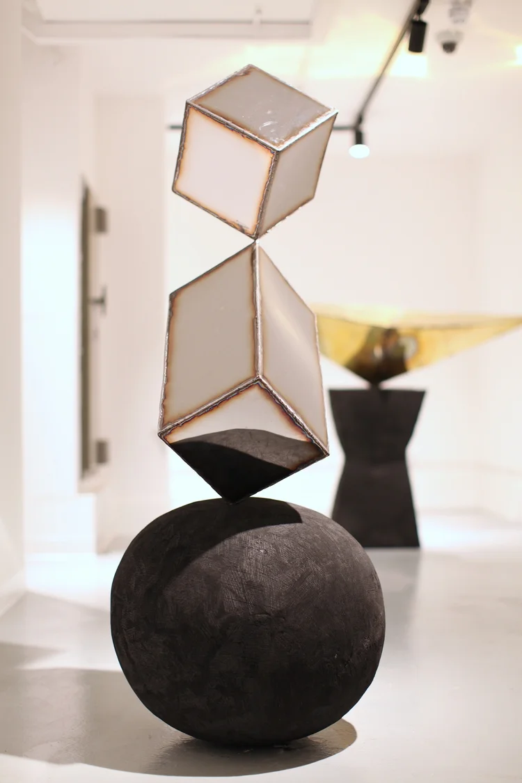 "Dancen," stainless steel and charred oak 