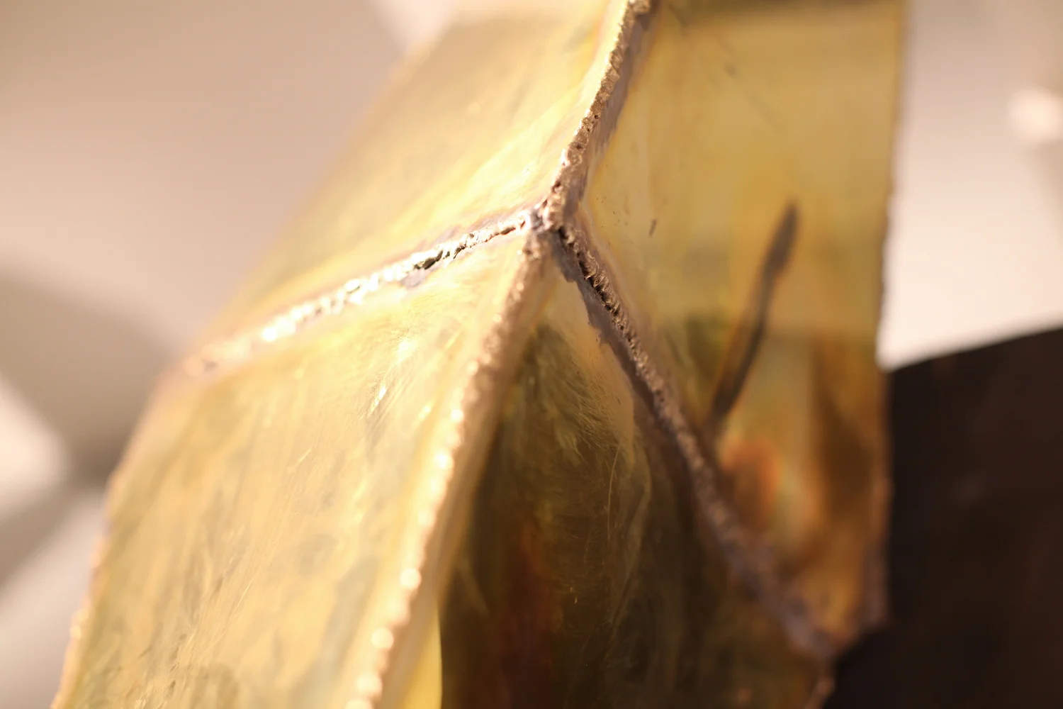 "Findan," brass and charred oak 