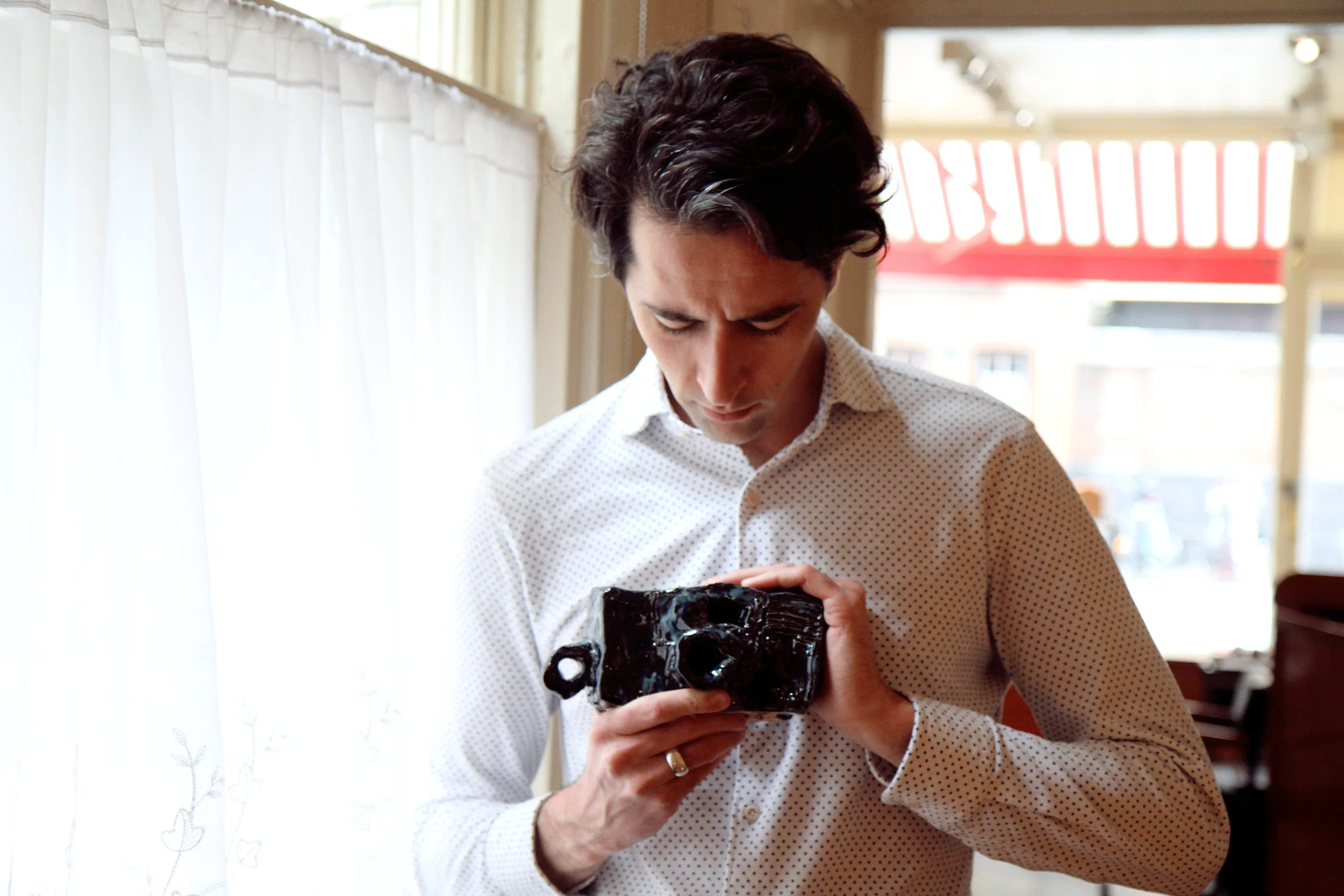 James Thomas holding an Alan Constable camera, 2017