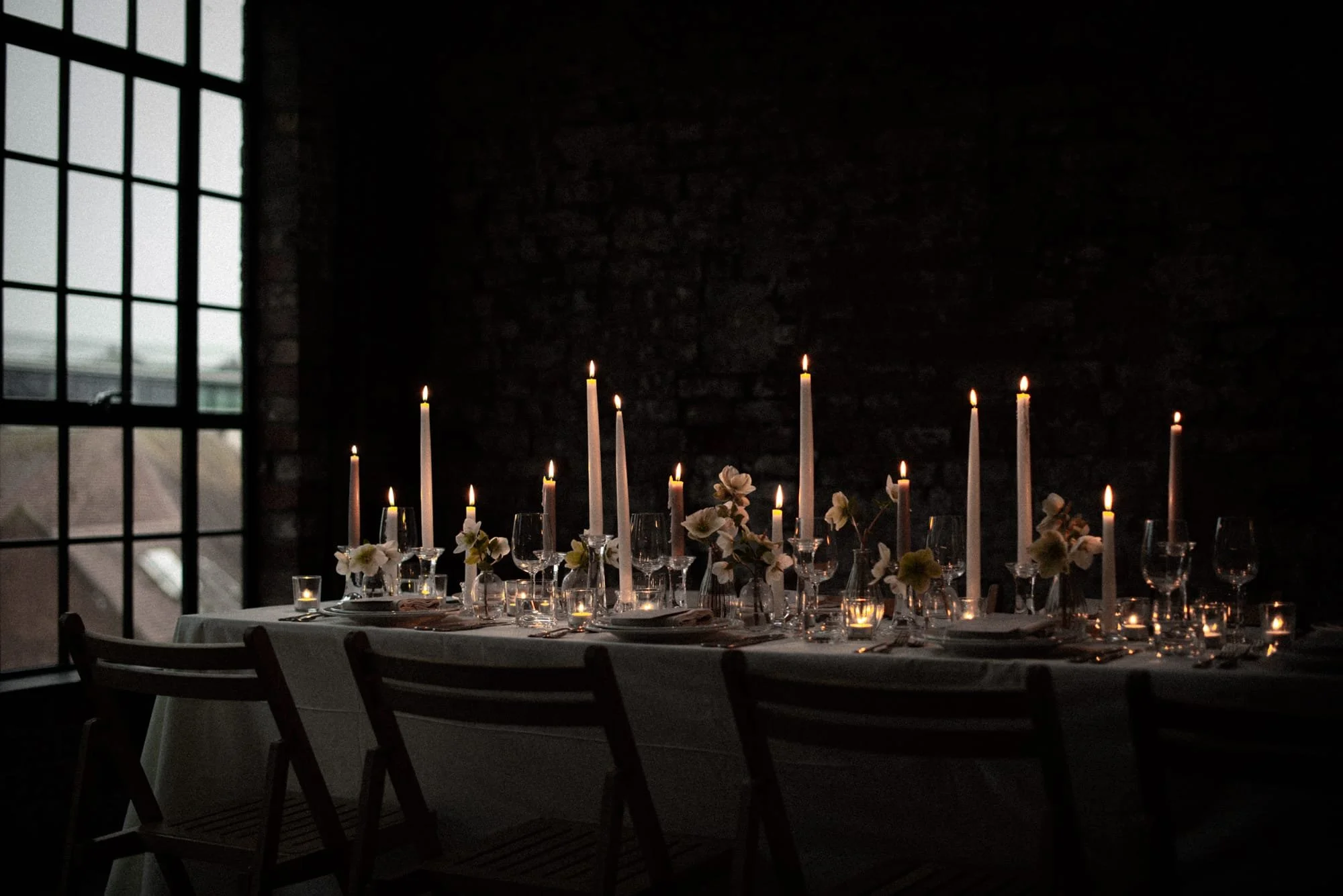 Candlelit winter wedding table styling with florals at an intimate Bristol venue