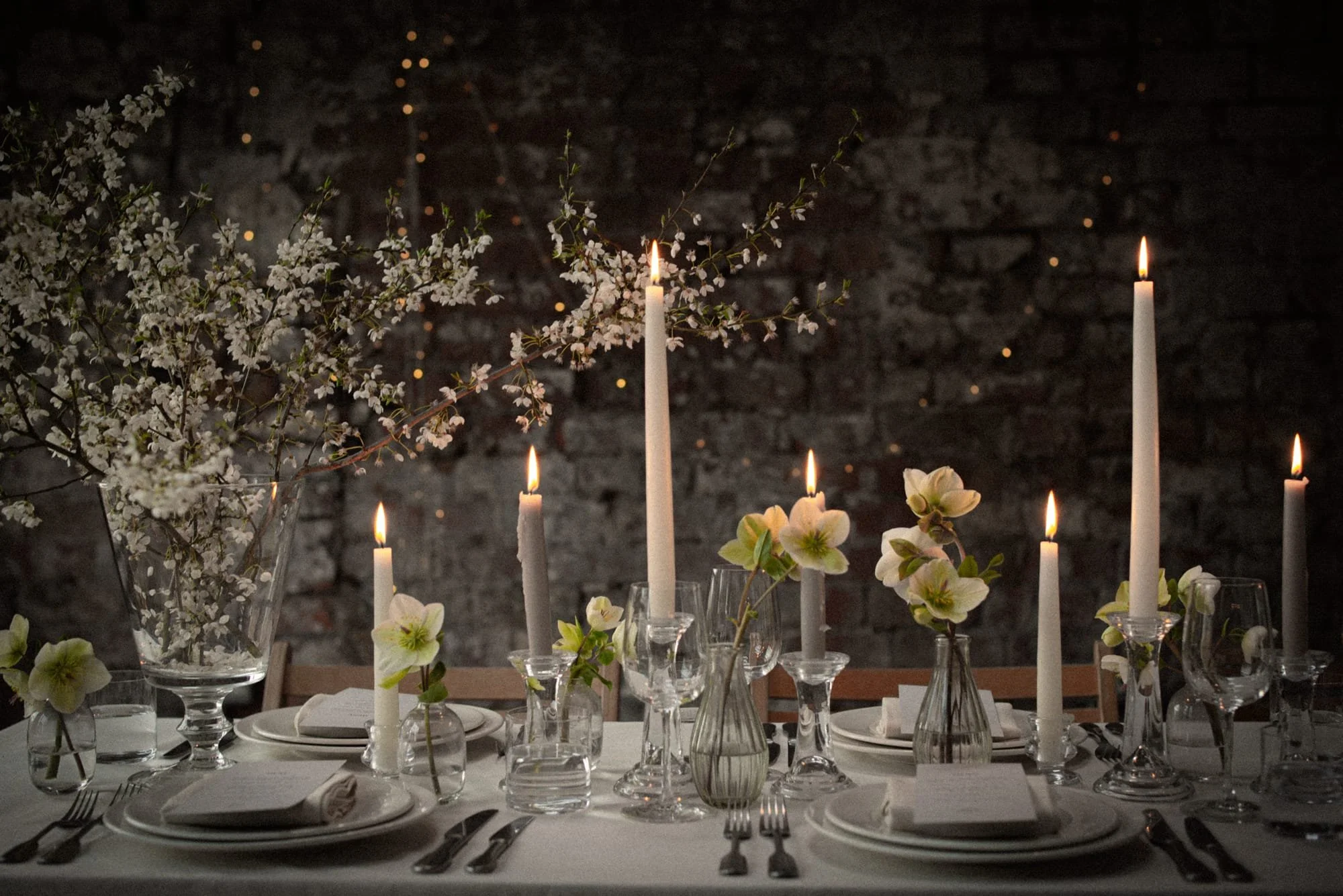 Winter wedding table with hellebore flowers and candlelight at a Bristol venue