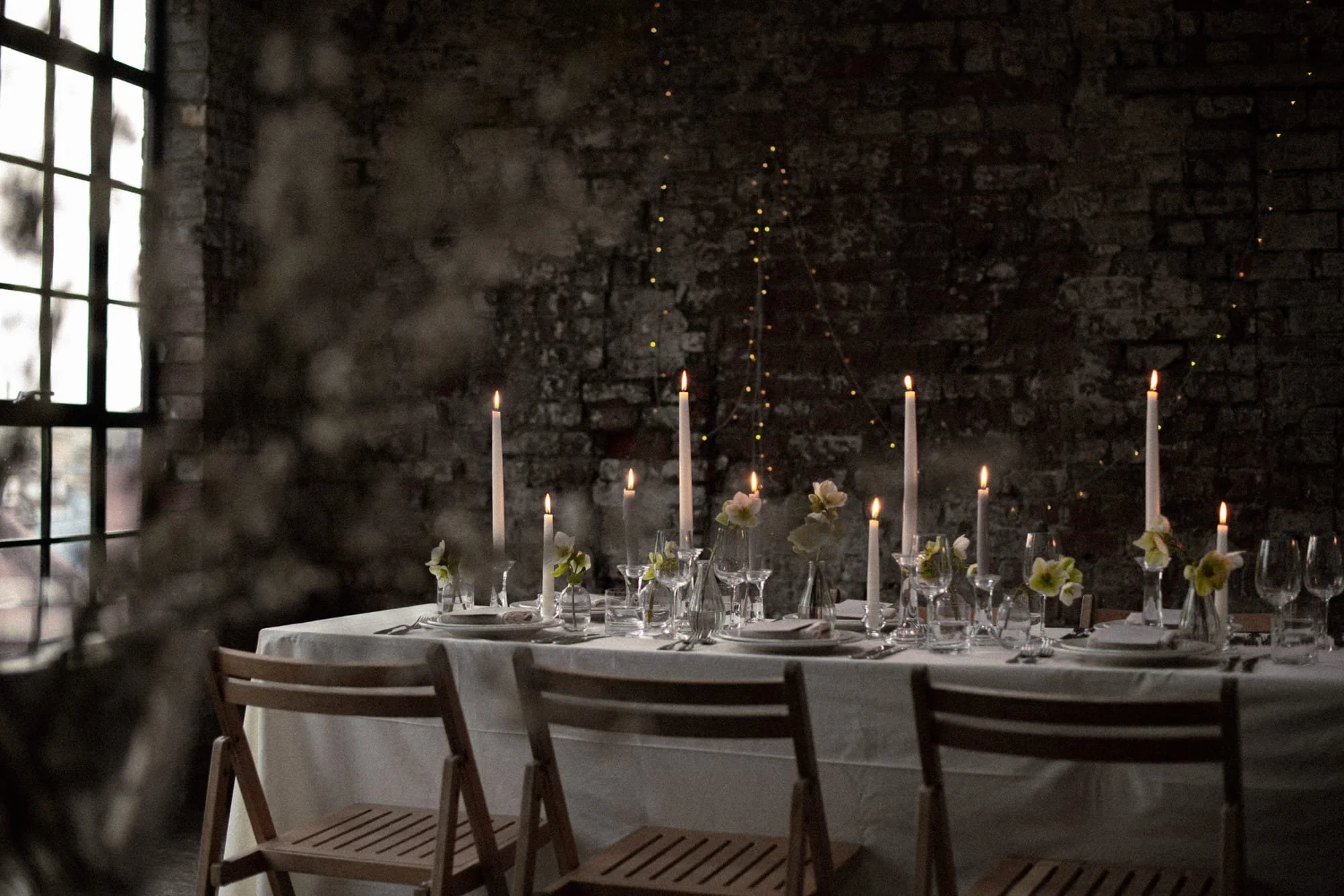Candlelit winter wedding table with florals at an intimate Bristol venue
