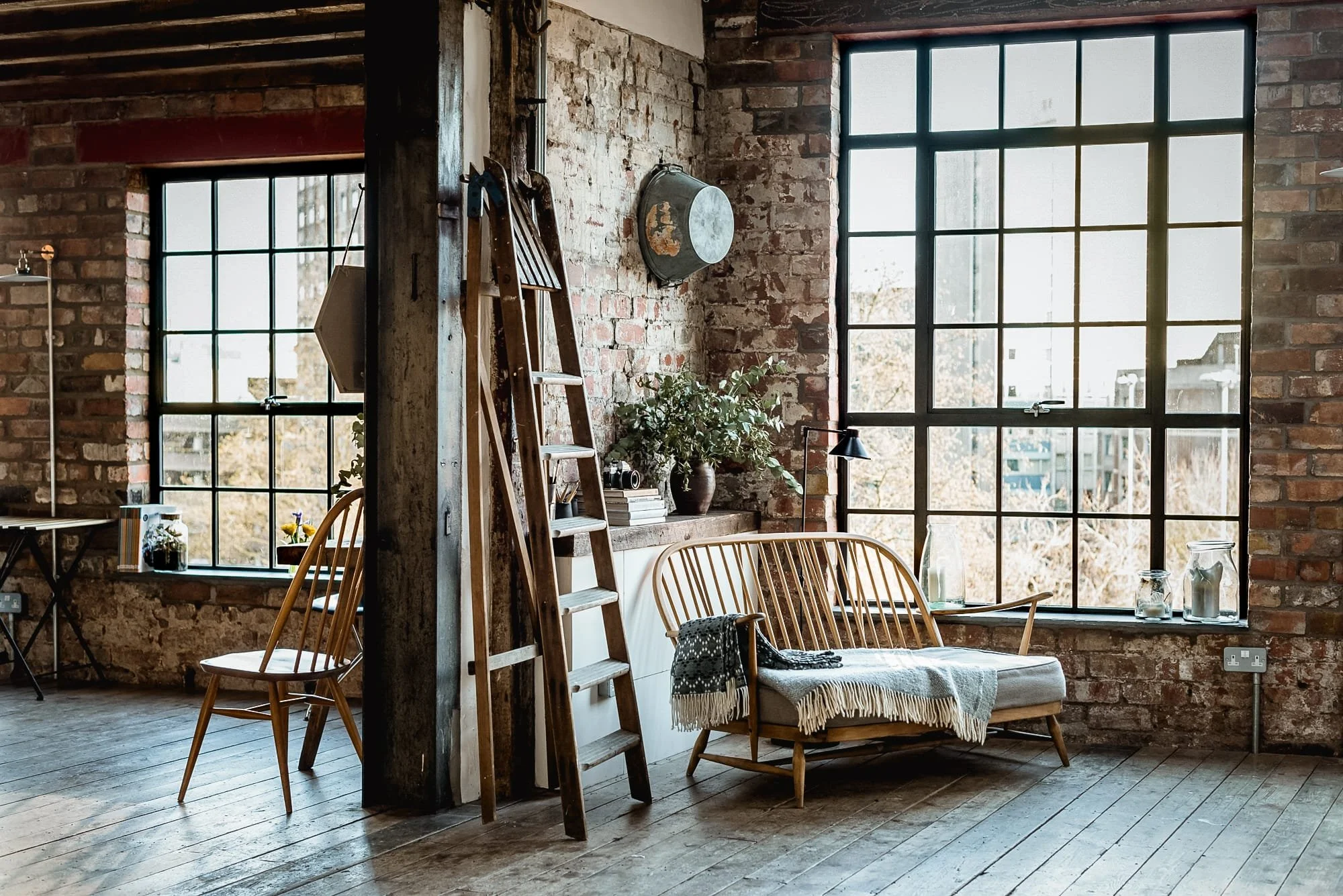Light-filled interior at The Forge, a Bristol event space with original brickwork and large industrial-style windows
