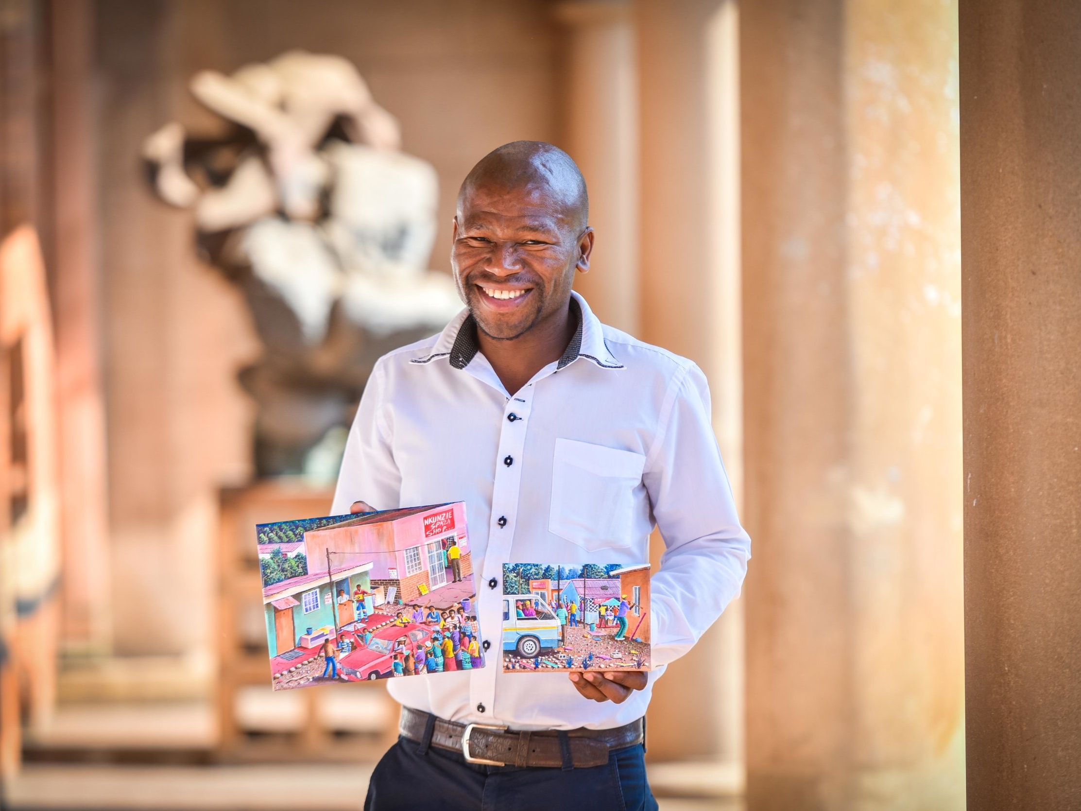 Pictured here is Siyabonga Sikosana handing over two artworks to FOTAG for the FABULOUS PICTURE SHOW 2016. See the FABULOUS PICTURE SHOW page for feedback on the sales.