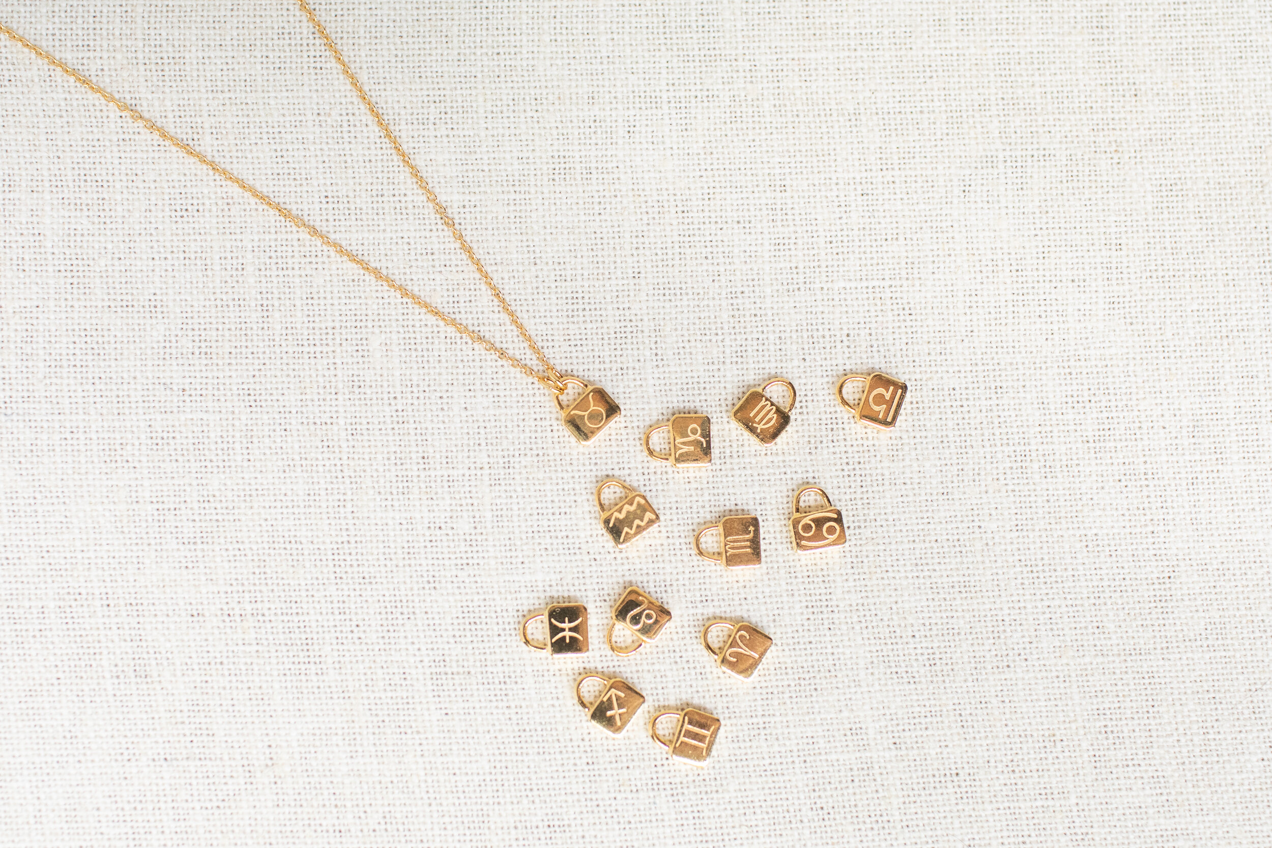 asha-patel-designs-zodiac-lock-necklace 