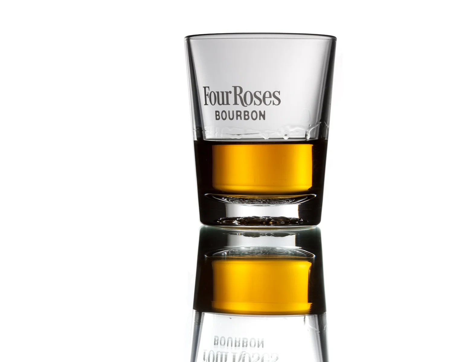 Four Roses glass with Bourbon on white