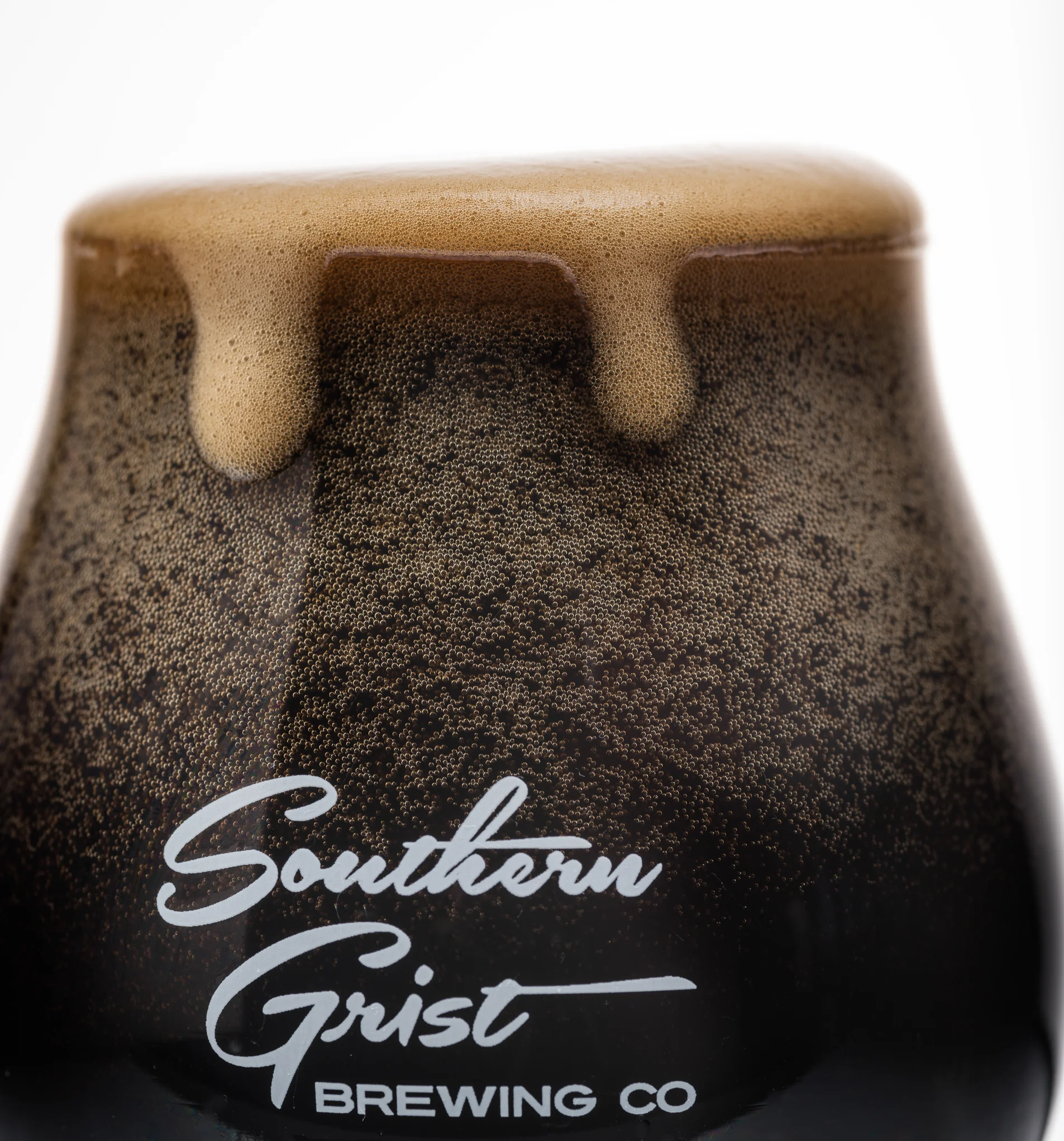 This is my favorite image form the shoot. I love how the head is gently coming over the top of the glass. Dark beers are always hard to photograph because the light does not travel though the dark liquid. So you have to make the shot about the head.
