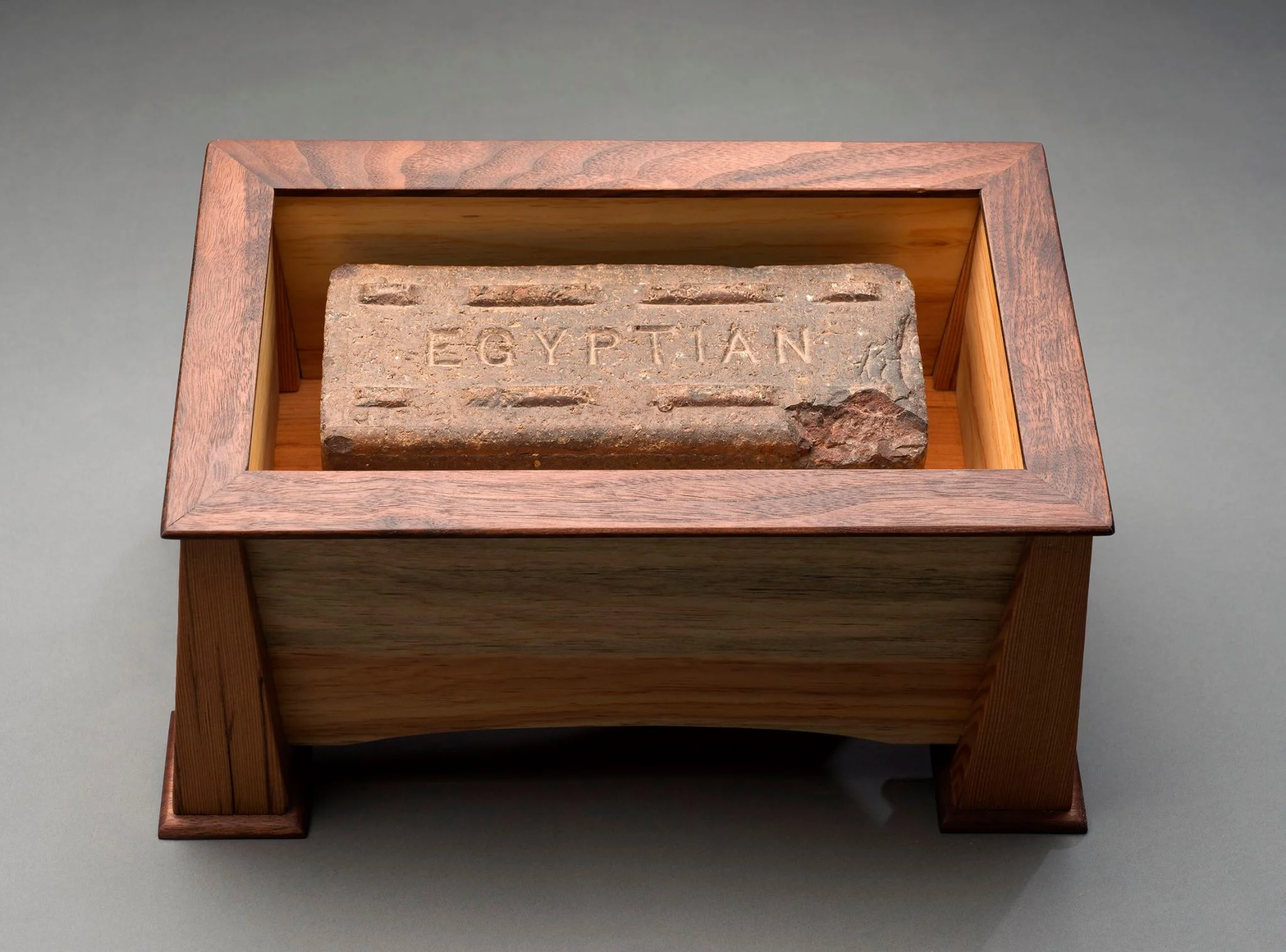 James Holmes, Brick Sarcophagus . 2012. Fir, walnut, pine, brick, sand, brass. 8 × 14 × 9 inches. (Inside view)