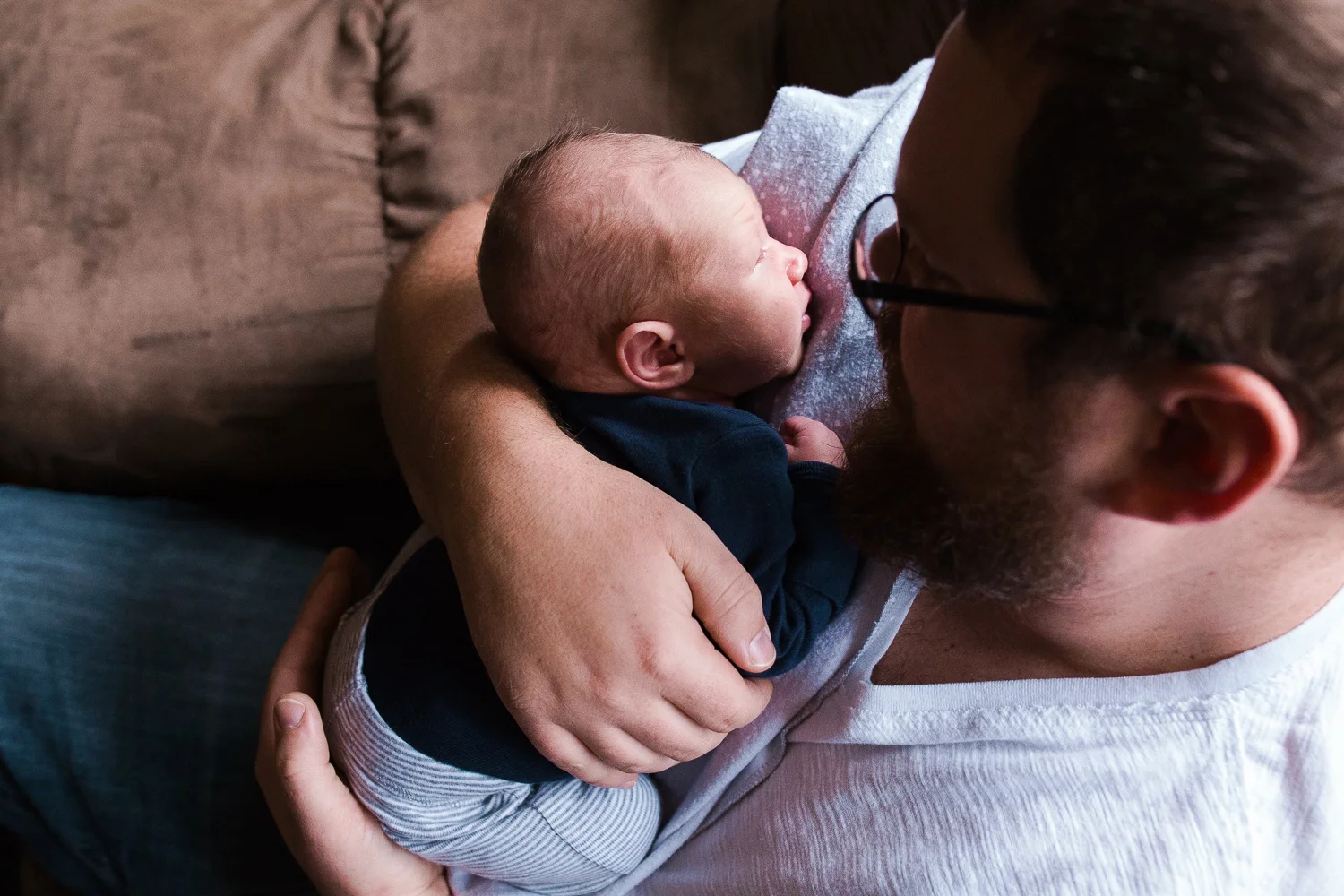 father holding his newborn son