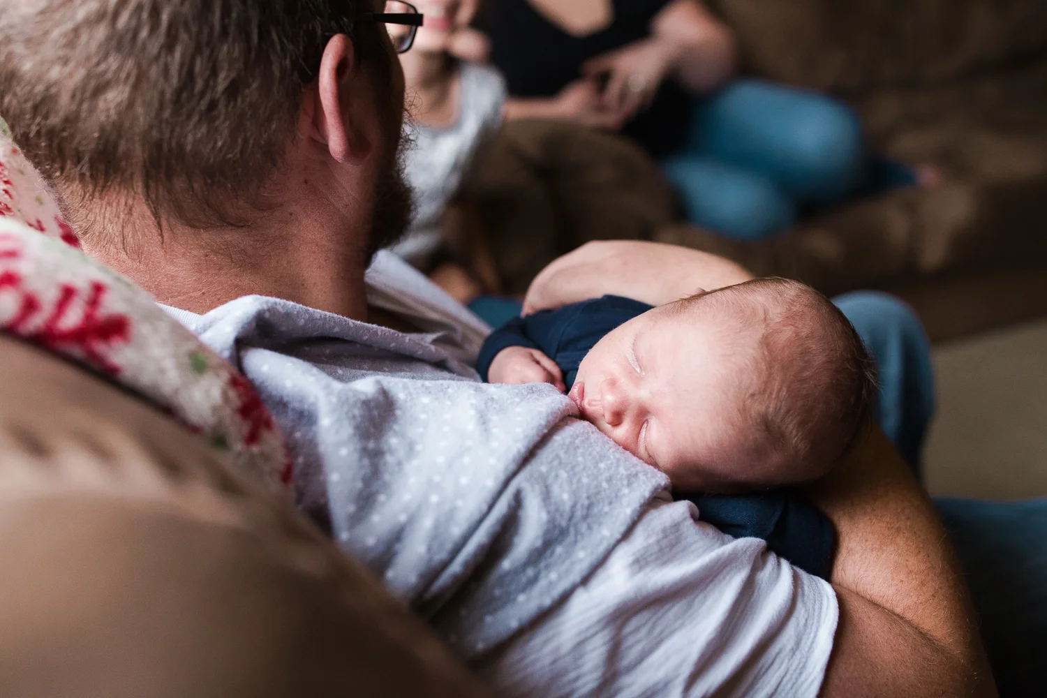 father holding his newborn son