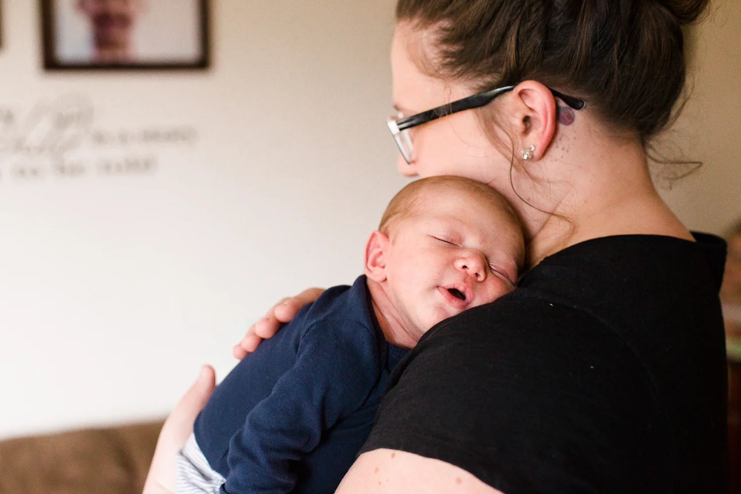mother holding her sleeping baby