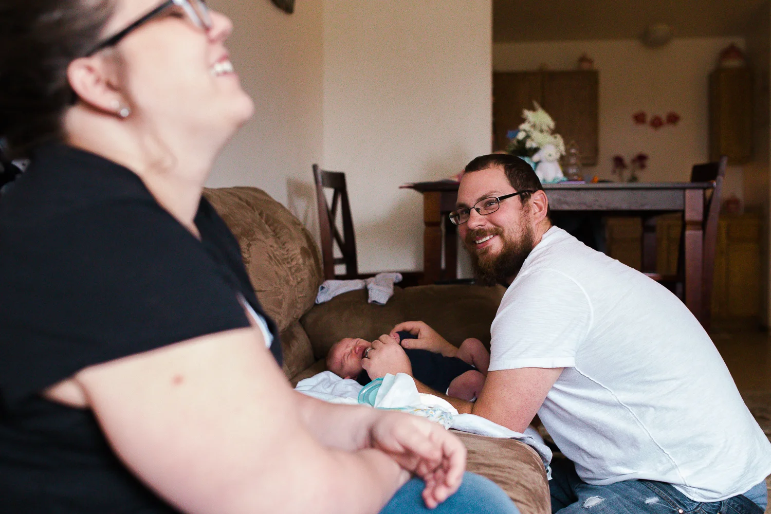 father holding his newborn son