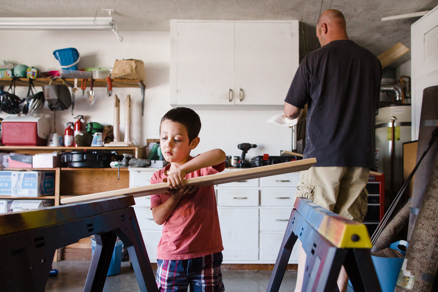 family making a bookshelf in the garage